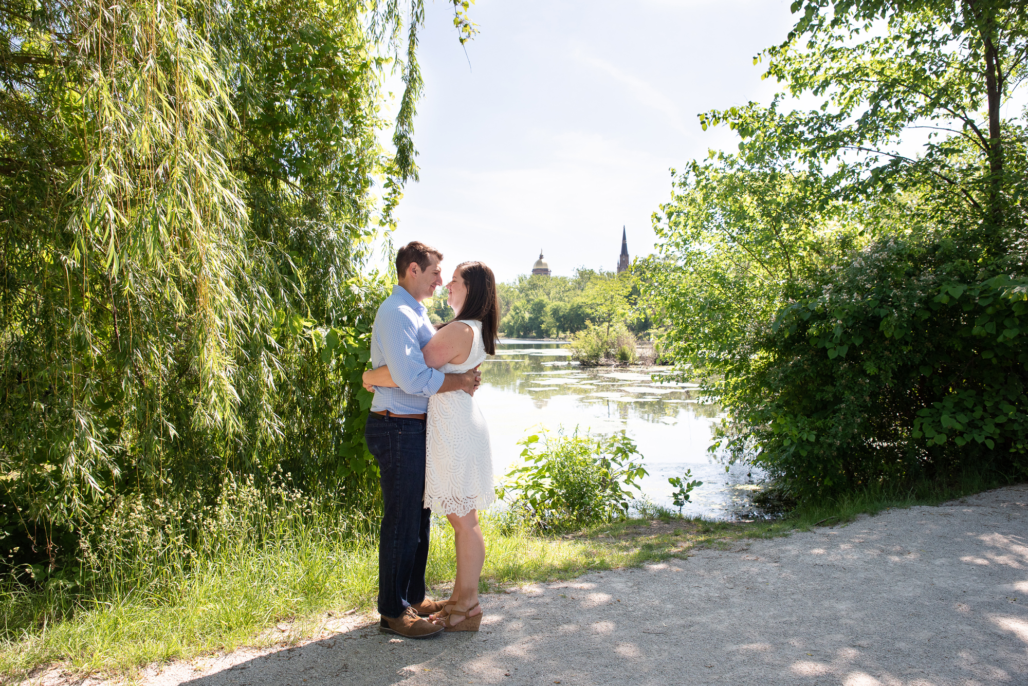 Couple in front of St Mary's Lake on the campus of University of Notre Dame