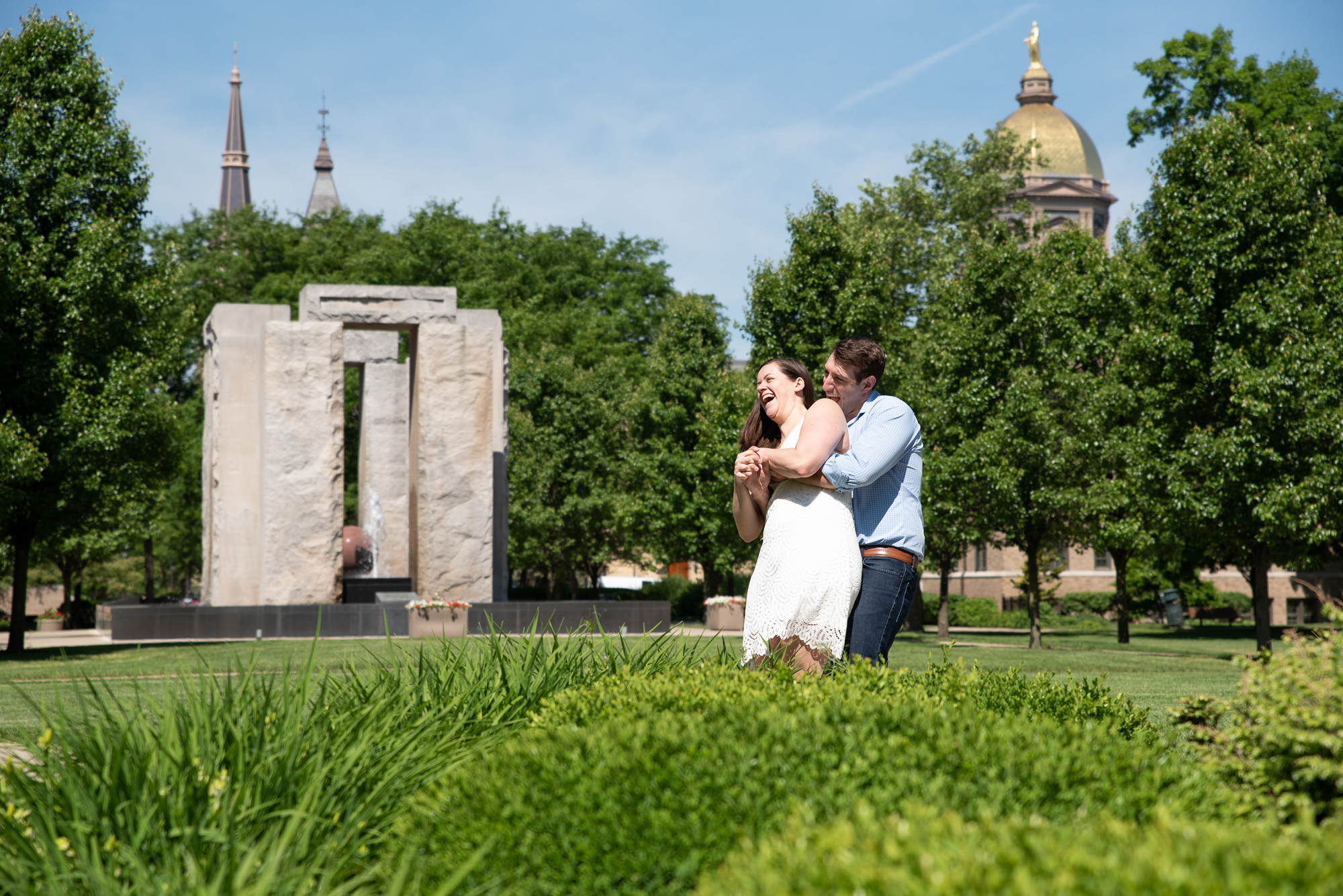 Couple in front of Clarke Memorial Fountain on the campus of University of Notre Dame