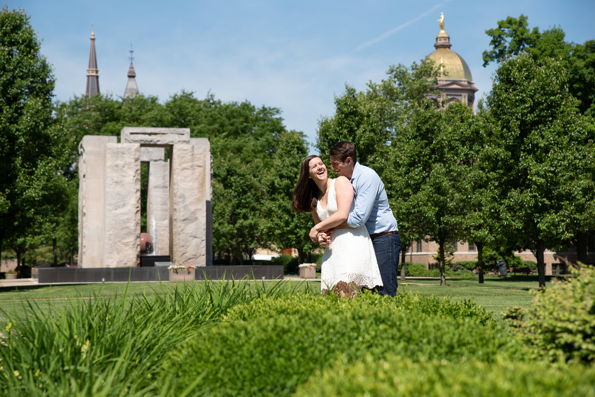 Couple in front of Clarke Memorial Fountain on the campus of University of Notre Dame