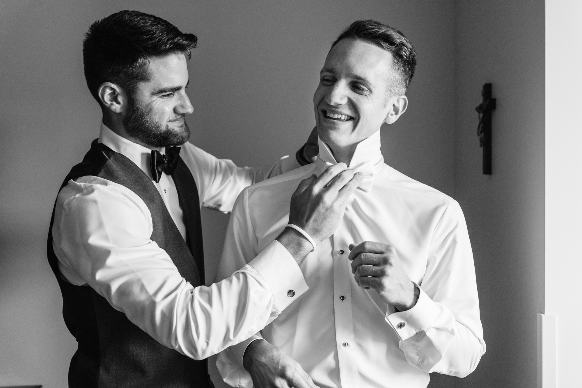 Groom getting ready before his wedding ceremony at the Basilica of the Sacred Heart on the campus of the University of Notre Dame