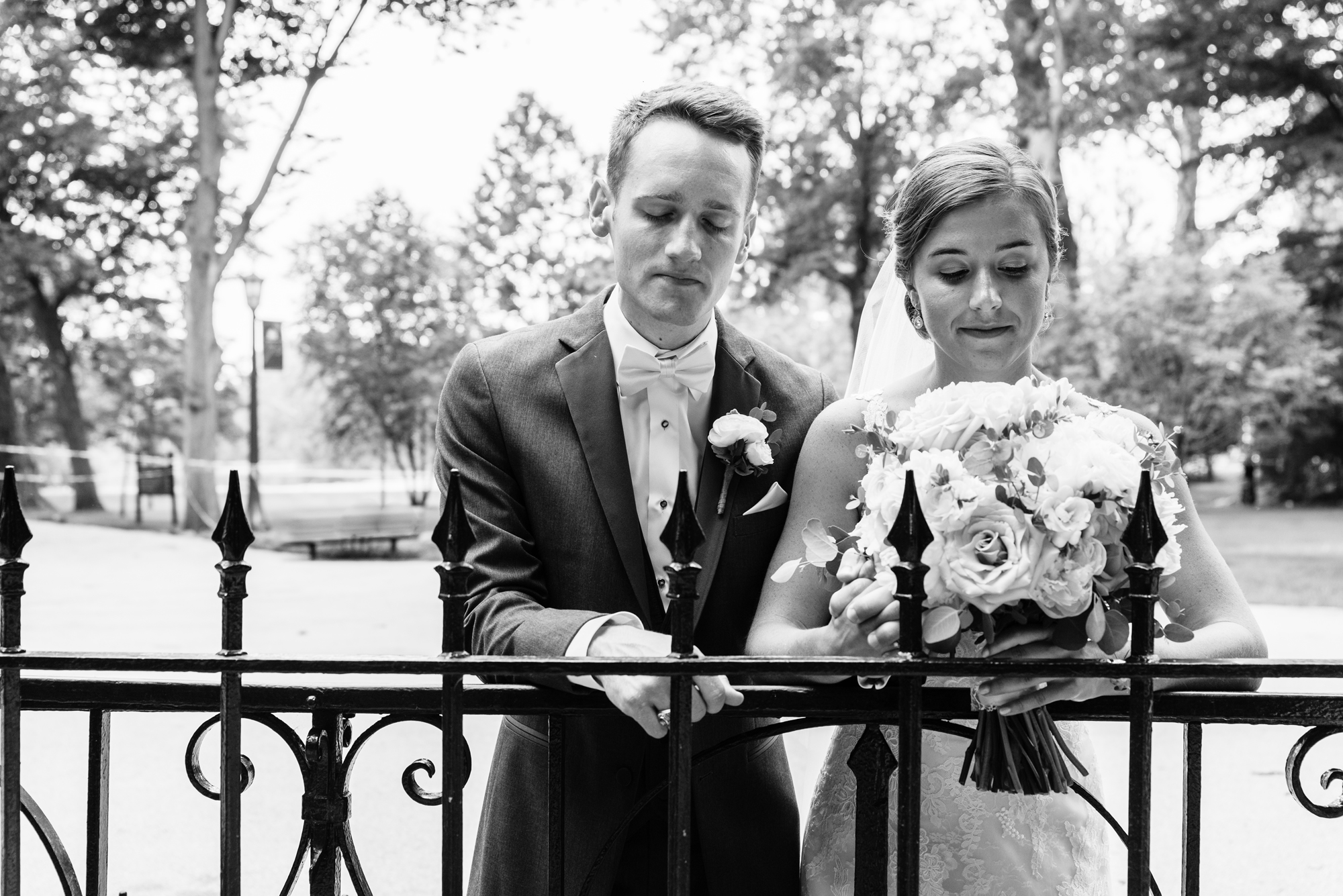 Bride & Groom lighting a candle at the Grotto before their wedding ceremony at the Basilica of the Sacred Heart on the campus of the University of Notre Dame