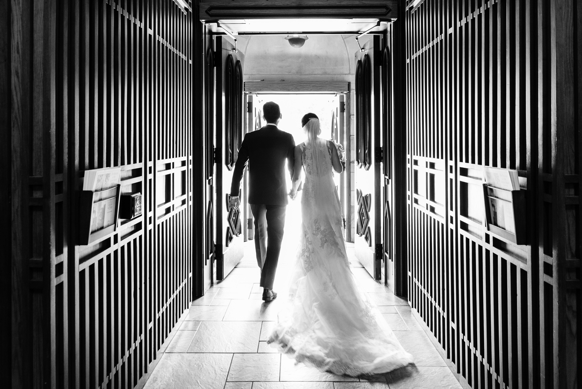 Bride & Groom leaving their wedding ceremony at the Basilica of the Sacred Heart on the campus of the University of Notre Dame from the God Country Doors