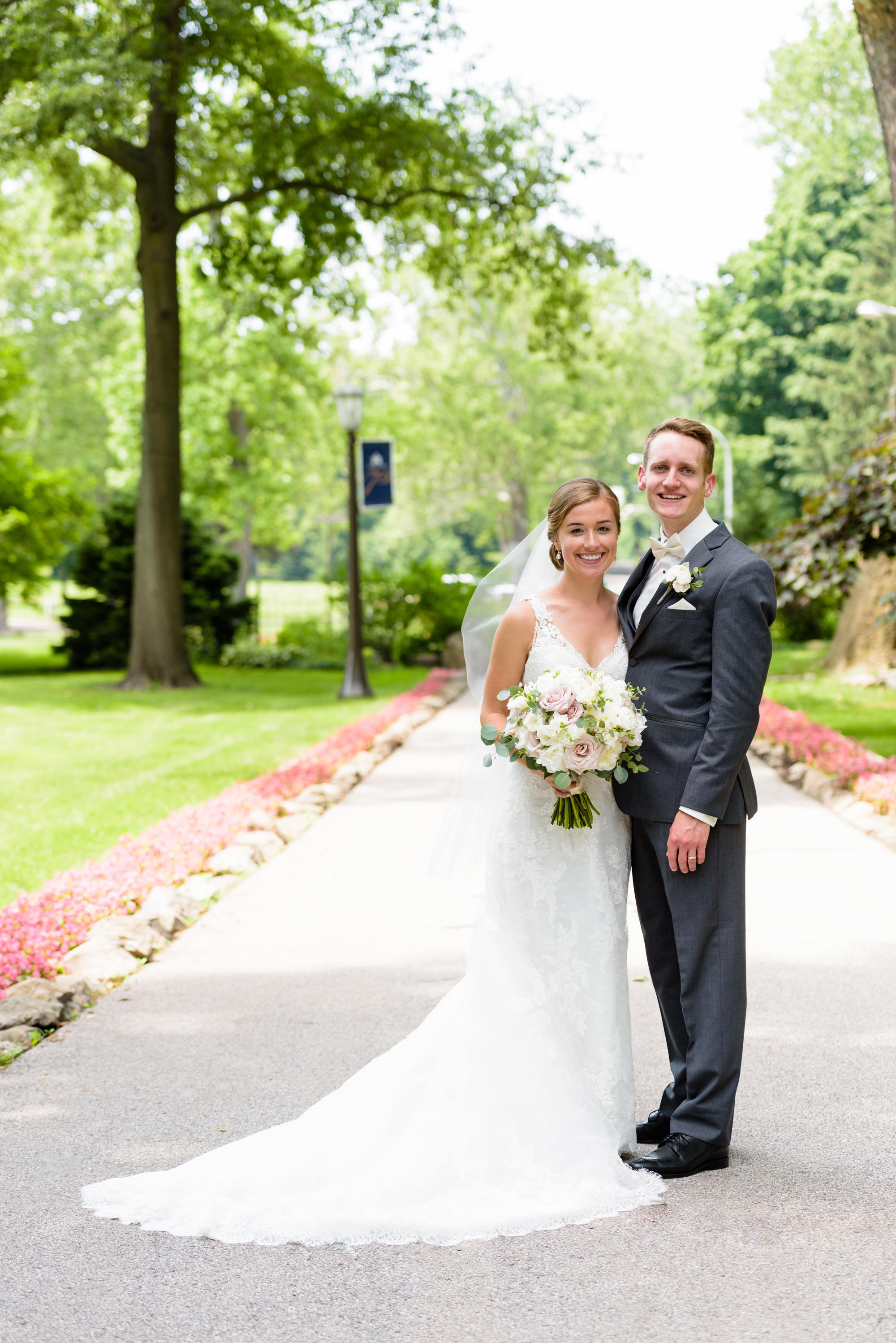 Bride & Groom with the Grotto on the campus of the University of Notre Dame