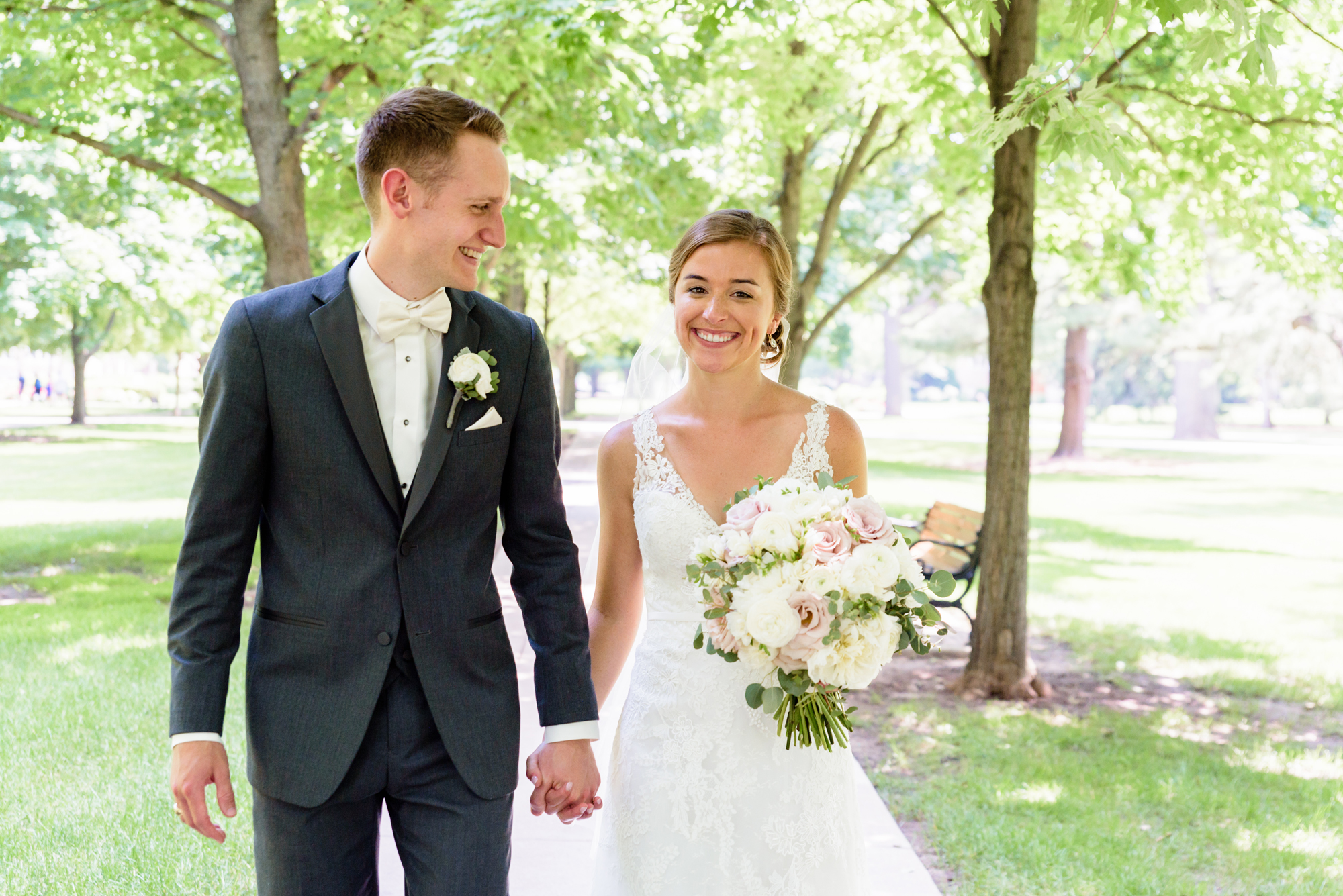 Bride & Groom under the canopy of trees on God Quad on the campus of the University of Notre Dame