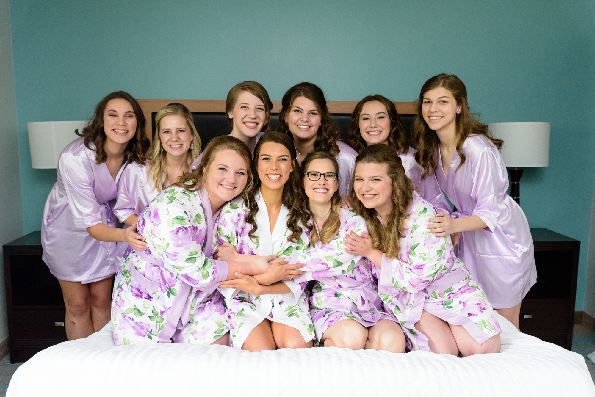 Bride and her Bridesmaids in robes for her wedding ceremony at the Basilica of the Sacred Heart on the campus of the University of Notre Dame