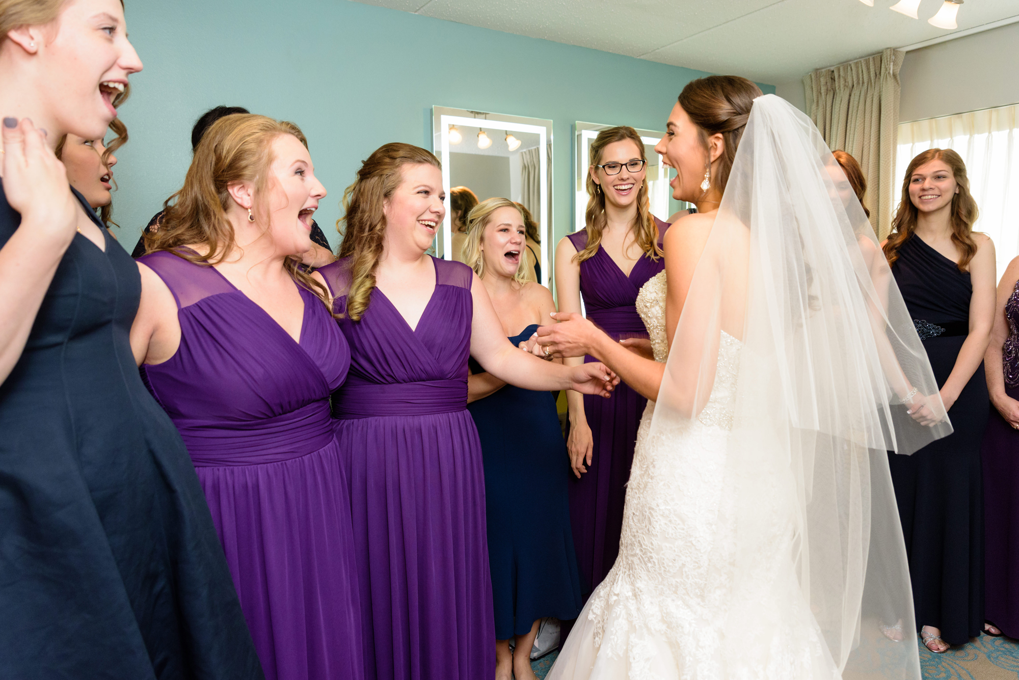 Bridesmaid reveal before a wedding ceremony at the Basilica of the Sacred Heart on the campus of the University of Notre Dame