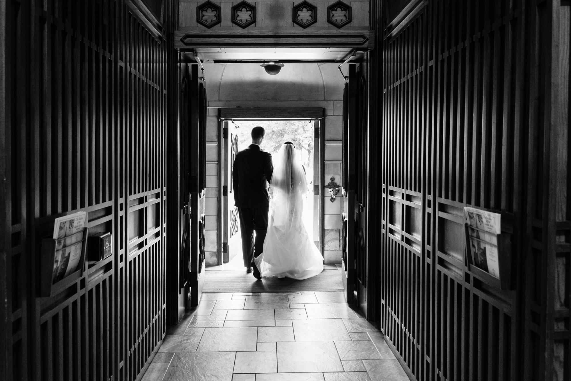 Bride & Groom leaving their wedding ceremony out the God Country Door at the Basilica of the Sacred Heart on the campus of the University of Notre Dame