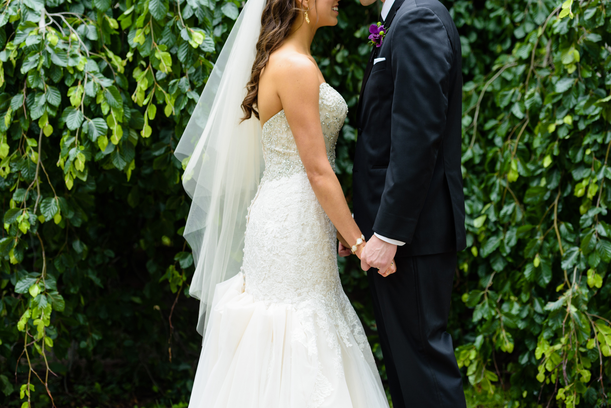 Bride & Groom in front of an exotic California inspired tree after their wedding ceremony at the Basilica of the Sacred Heart on the campus of the University of Notre Dame