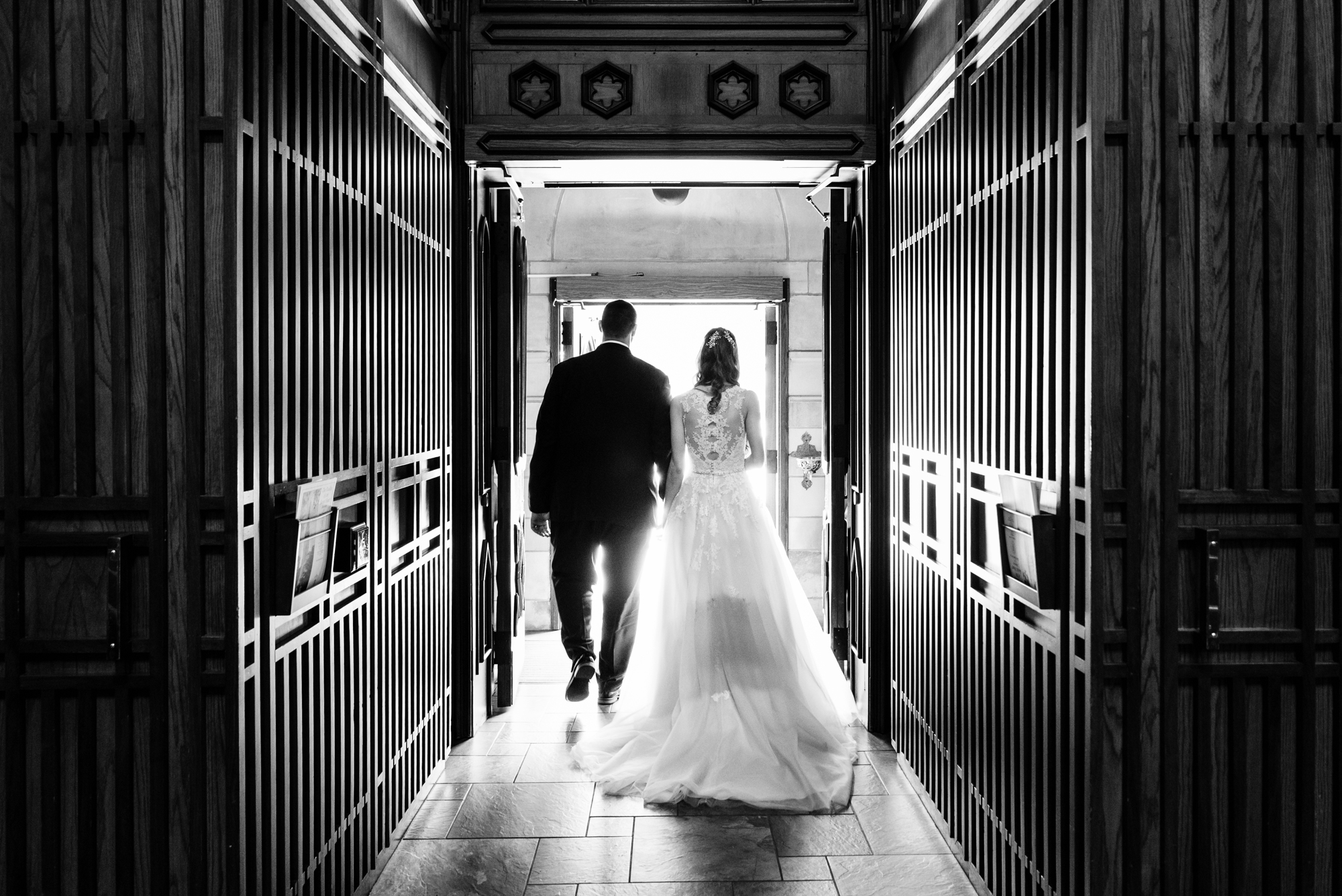 Bride & Groom leaving their wedding ceremony out the God Country Door at the Basilica of the Sacred Heart on the campus of the University of Notre Dame