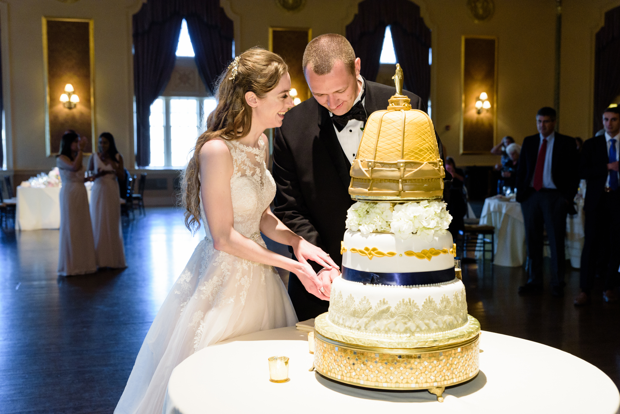 Bride & Groom’s cake cutting at a Wedding Reception at Palais Royale