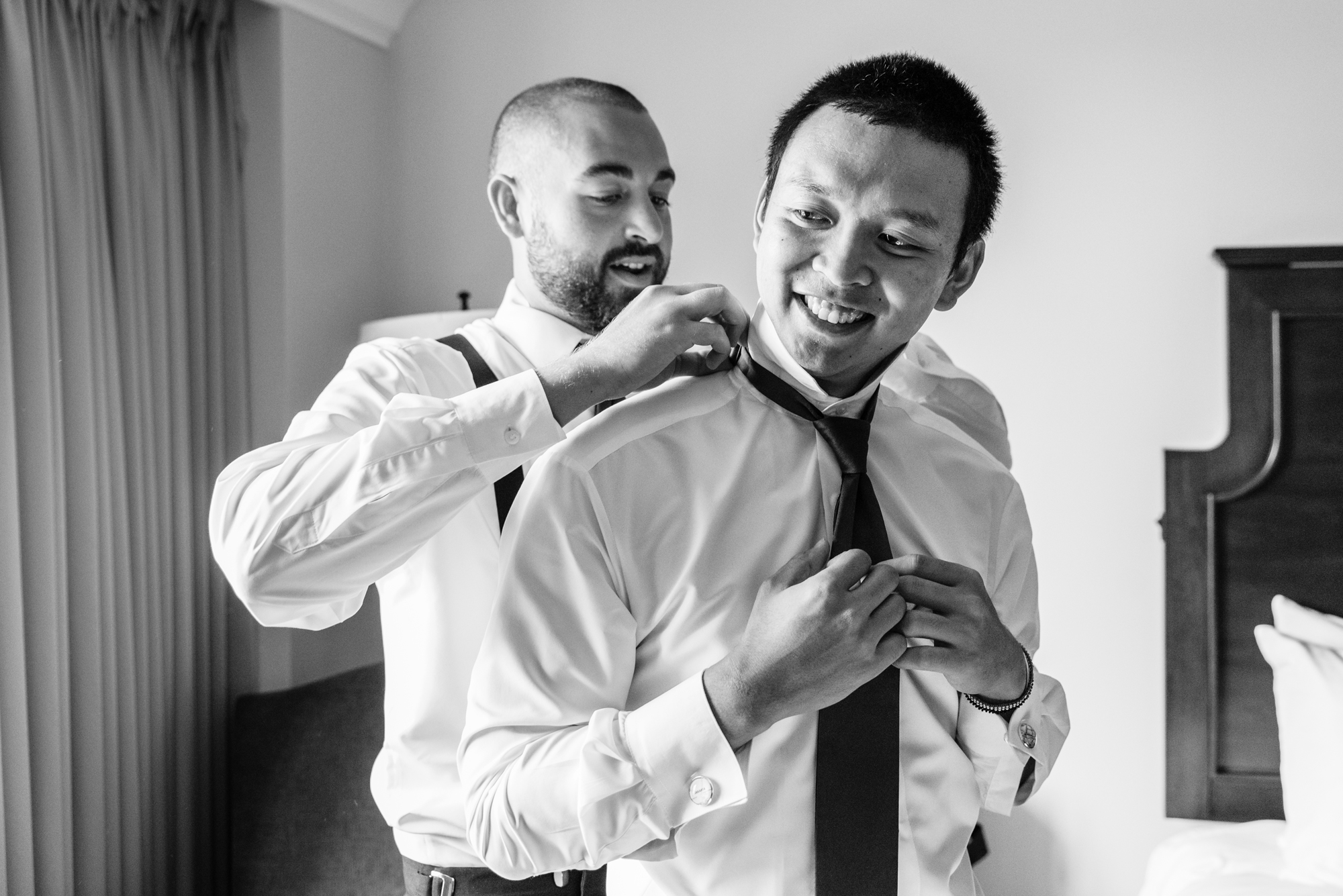 Groom getting ready for his wedding ceremony at the Basilica of the Sacred Heart on the campus of the University of Notre Dame