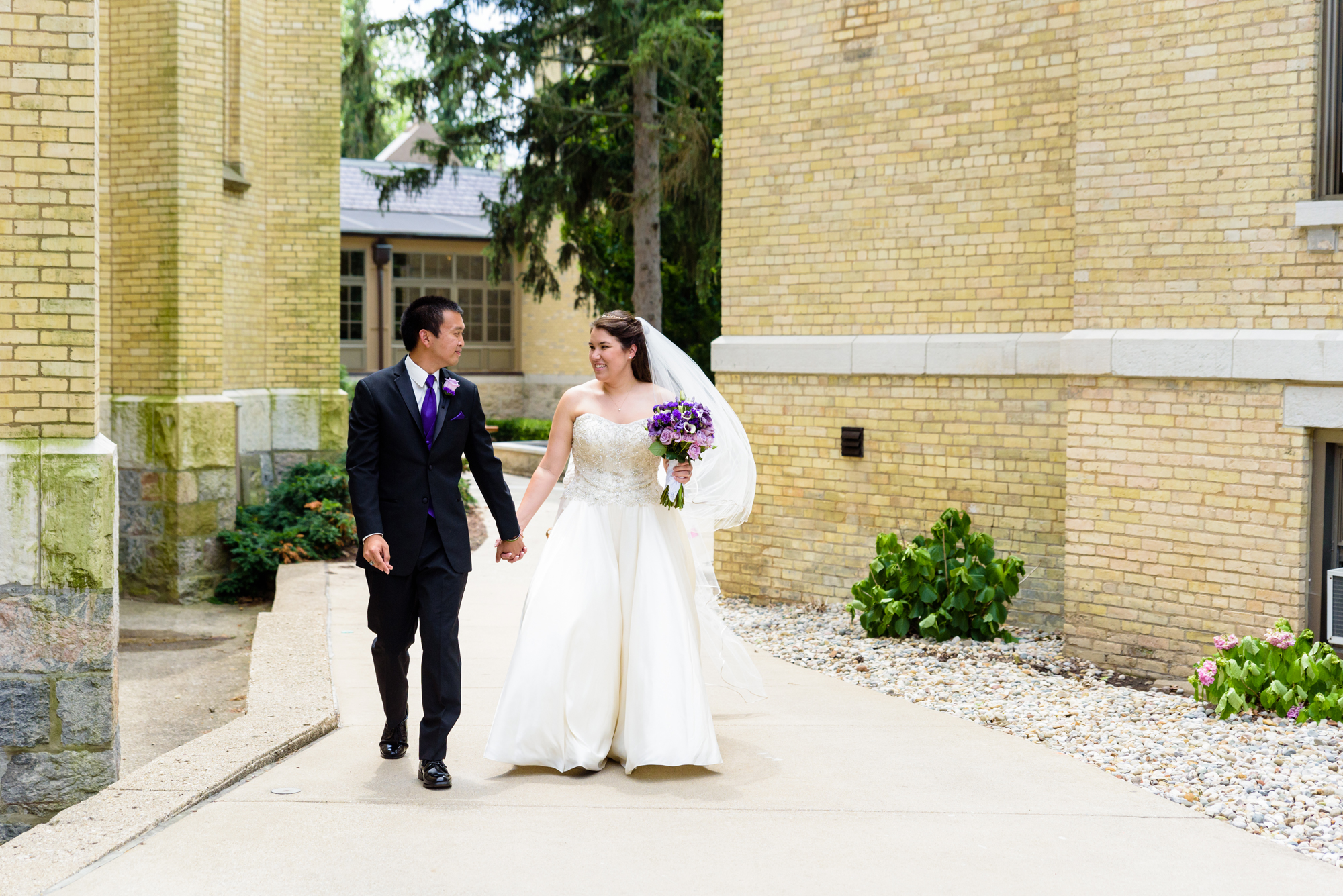 Bride & Groom walking to their wedding ceremony at the Basilica of the Sacred Heart on the campus of the University of Notre Dame