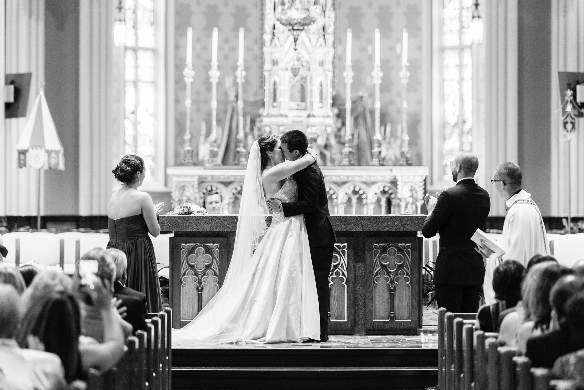 Wedding ceremony first kiss at the Basilica of the Sacred Heart on the campus of the University of Notre Dame