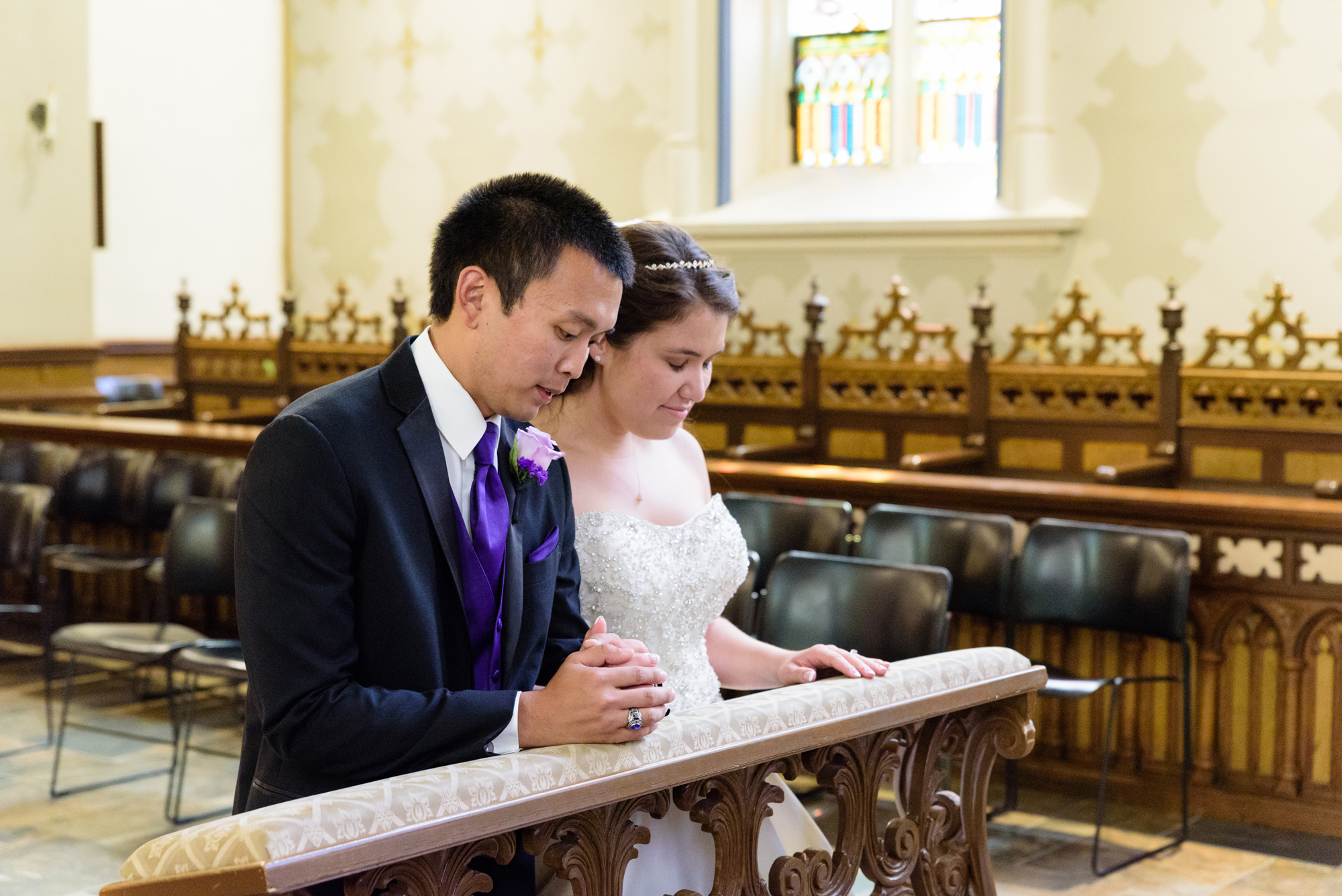 Wedding ceremony praying to Mary at the Basilica of the Sacred Heart on the campus of the University of Notre Dame