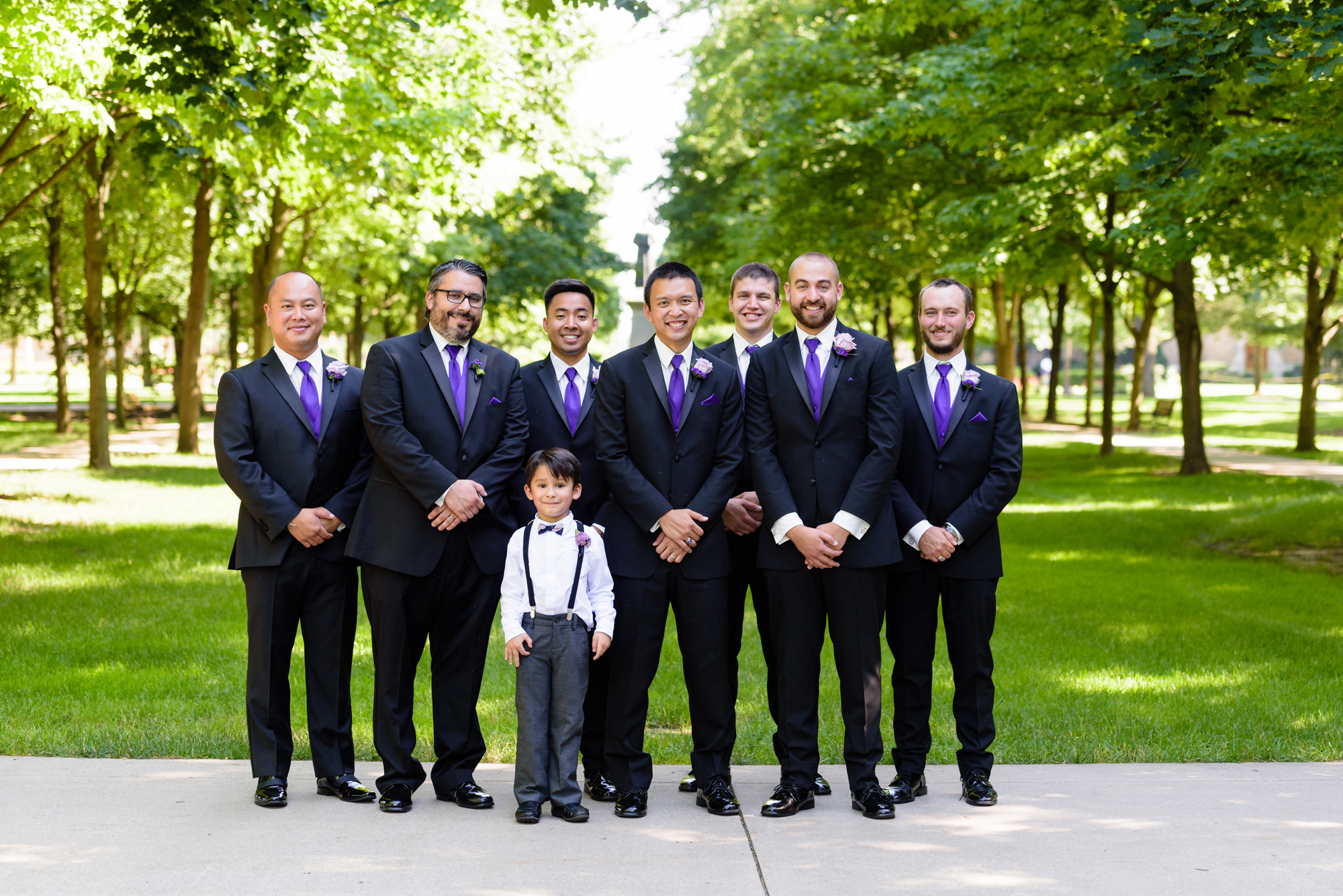 Groomsmen on God Quad after their wedding ceremony at the Basilica of the Sacred Heart on the campus of the University of Notre Dame