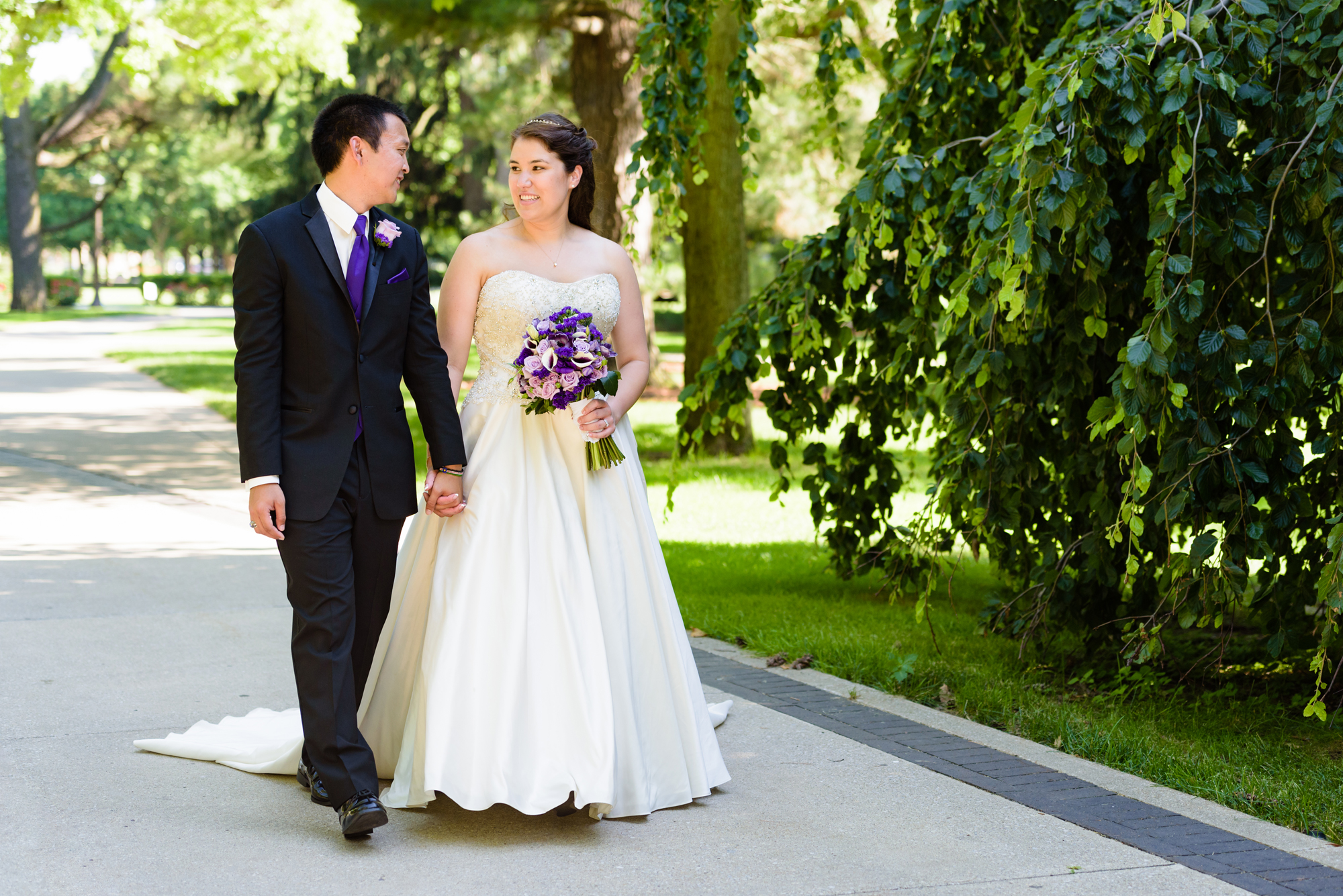 Bride & Groom in front of an exotic California inspired tree after their wedding ceremony at the Basilica of the Sacred Heart on the campus of the University of Notre Dame