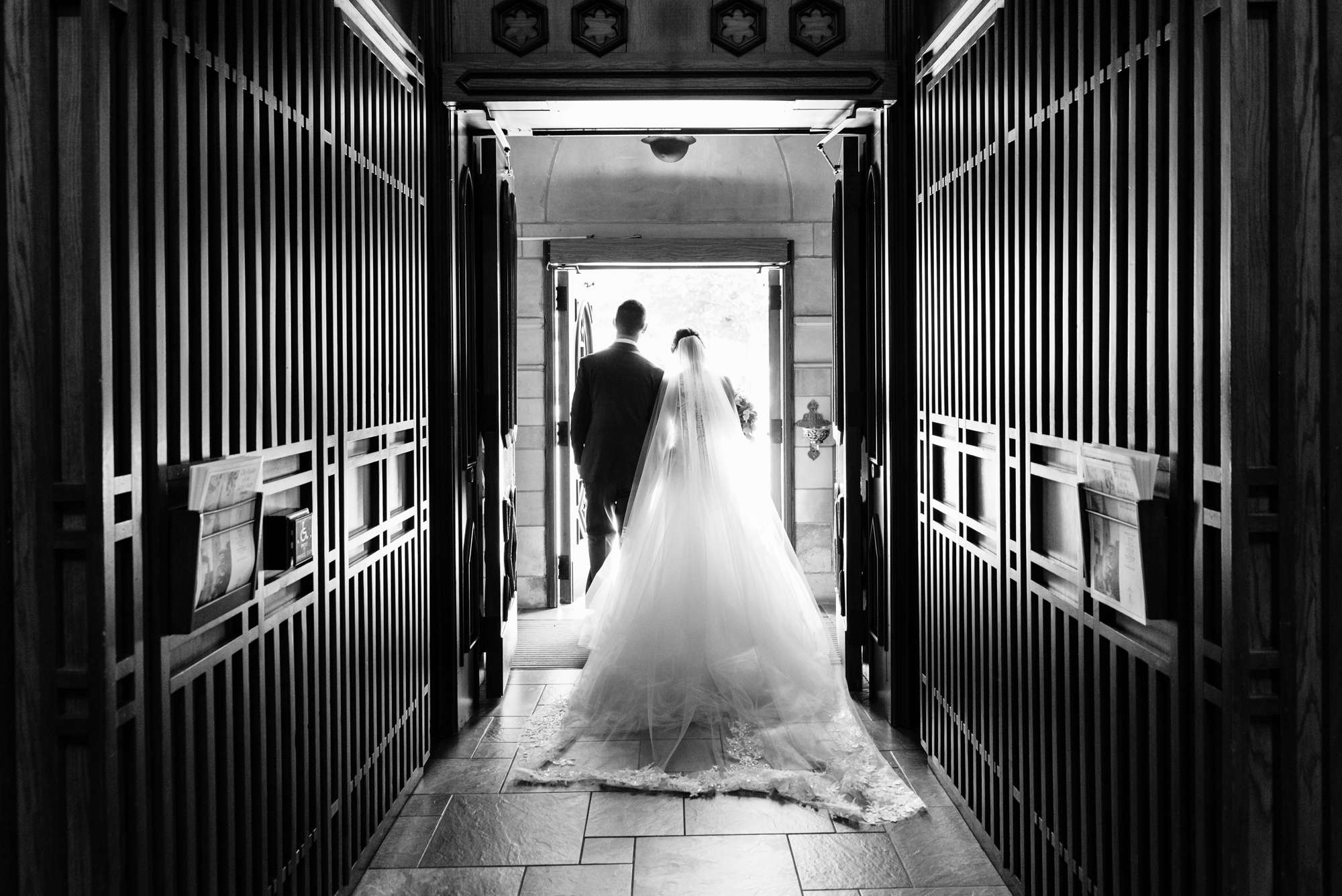 Bride & Groom leaving their wedding ceremony out the God Country Door at the Basilica of the Sacred Heart on the campus of the University of Notre Dame