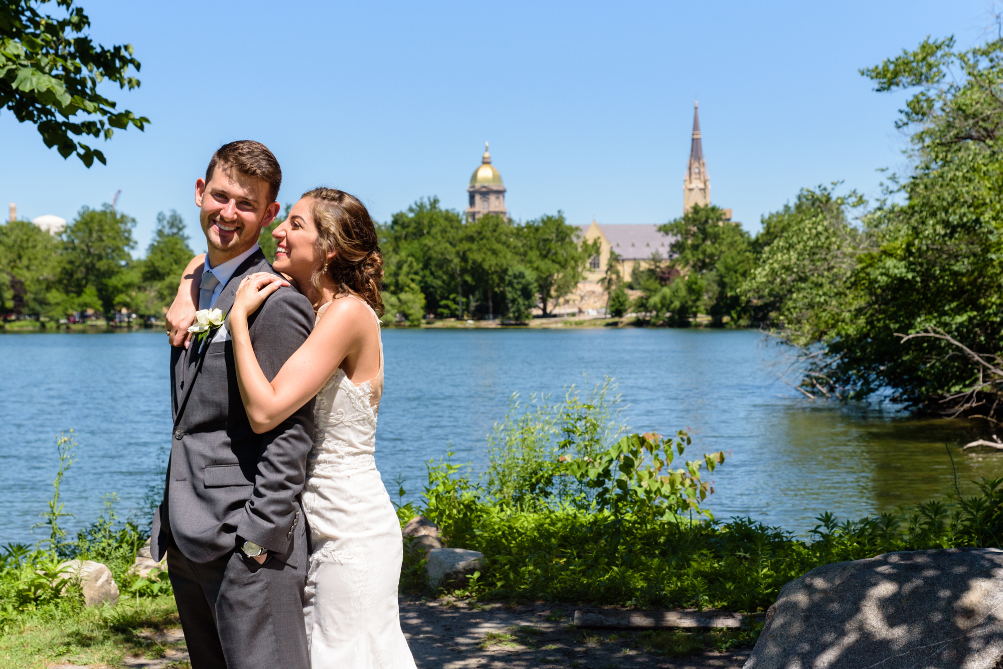 Bride & Groom with the Golden Dome, Basilica & St Mary's Lake after a wedding ceremony at the Basilica of the Sacred Heart on the campus of the University of Notre Dame