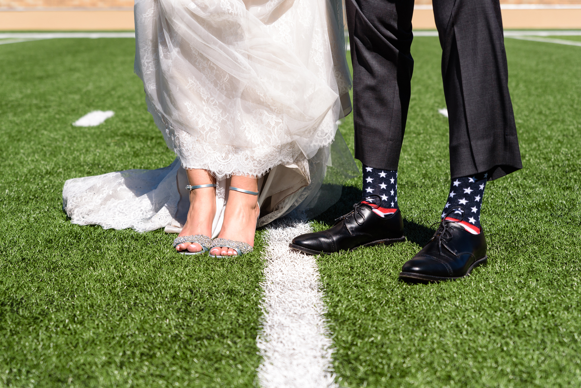 Groom's Socks in the Football Stadium after their wedding ceremony at the Basilica of the Sacred Heart on the campus of the University of Notre Dame