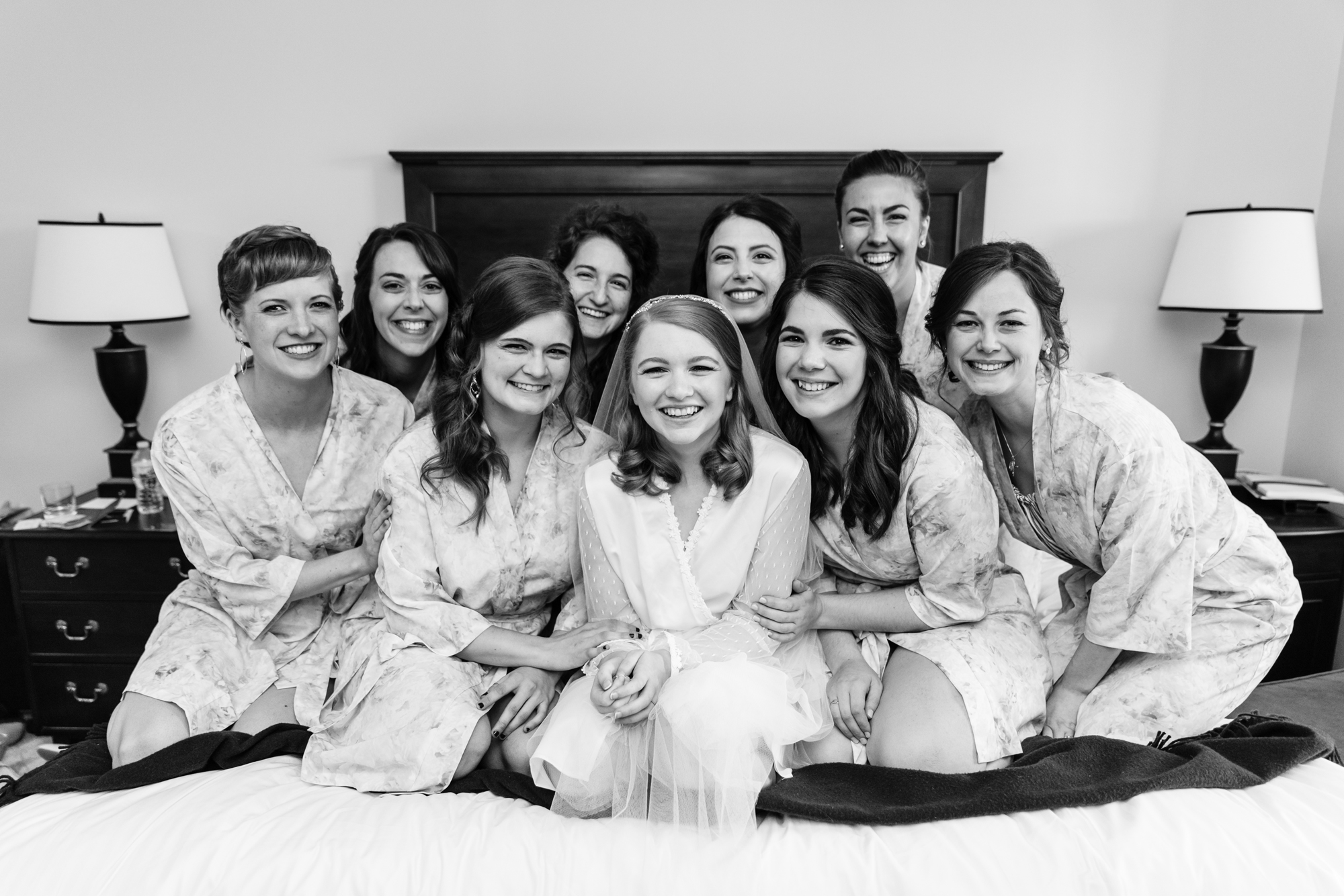 Bride and her Bridesmaids in robes for her wedding ceremony at the Basilica of the Sacred Heart on the campus of the University of Notre Dame