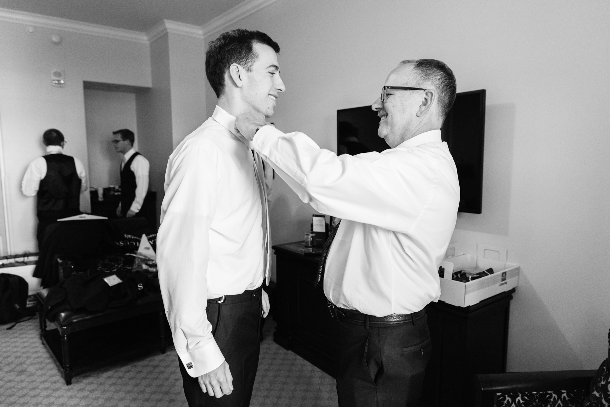 Groom getting ready for his wedding ceremony at the Basilica of the Sacred Heart on the campus of the University of Notre Dame