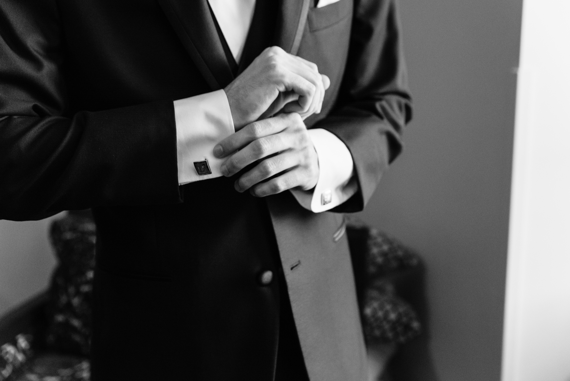 Groom getting ready for his wedding ceremony at the Basilica of the Sacred Heart on the campus of the University of Notre Dame