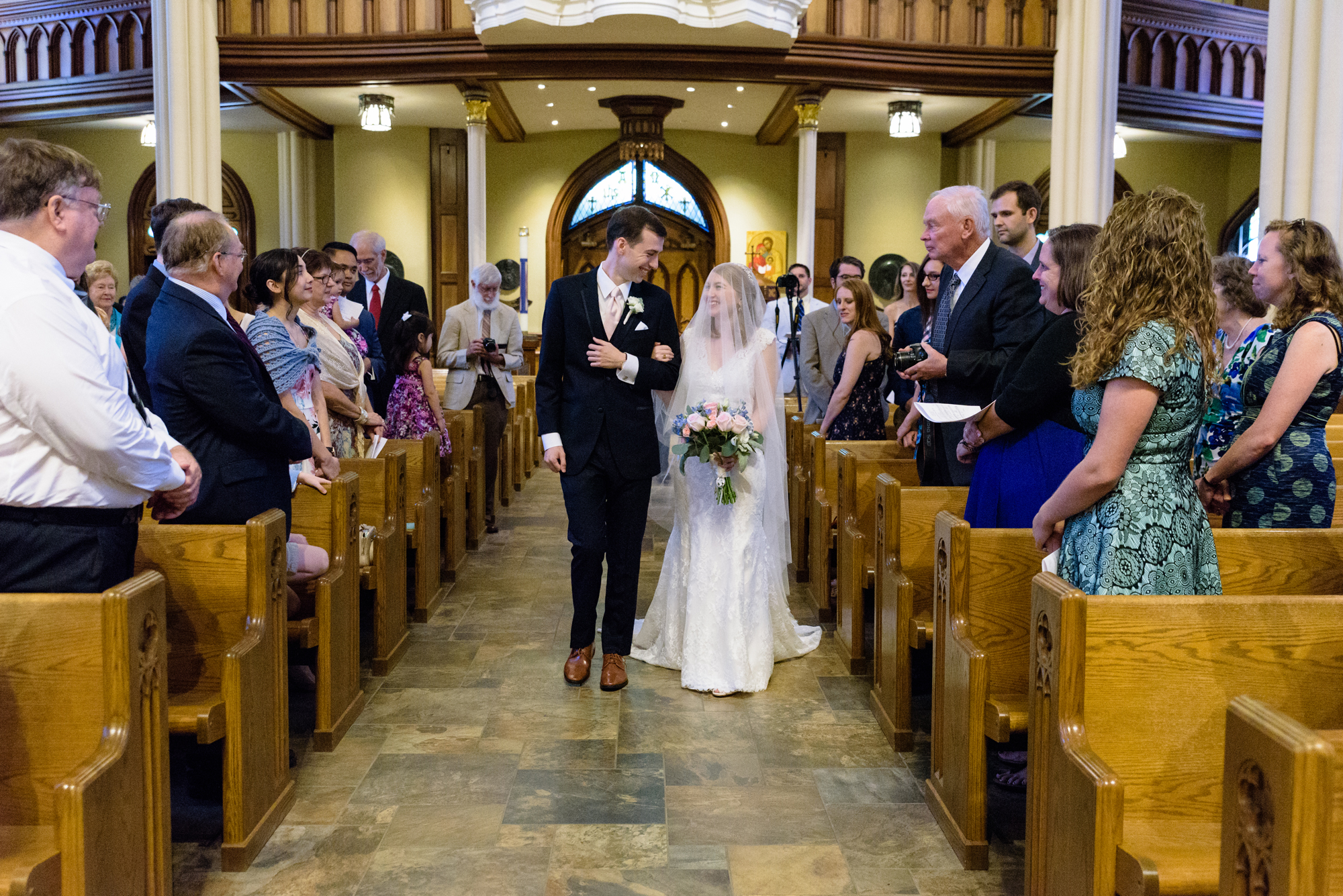 Wedding Processional at a wedding ceremony at the Basilica of the Sacred Heart on the campus of the University of Notre Dame