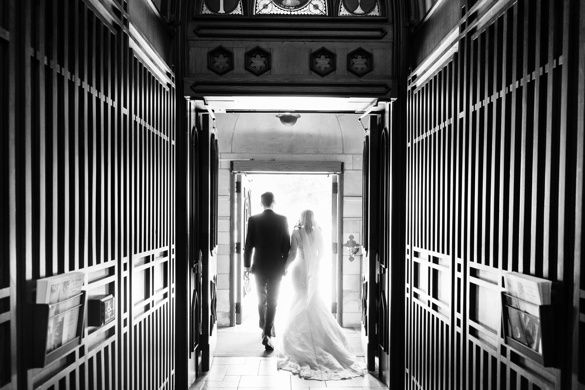 Bride & Groom leaving their wedding ceremony out the God Country Door at the Basilica of the Sacred Heart on the campus of the University of Notre Dame