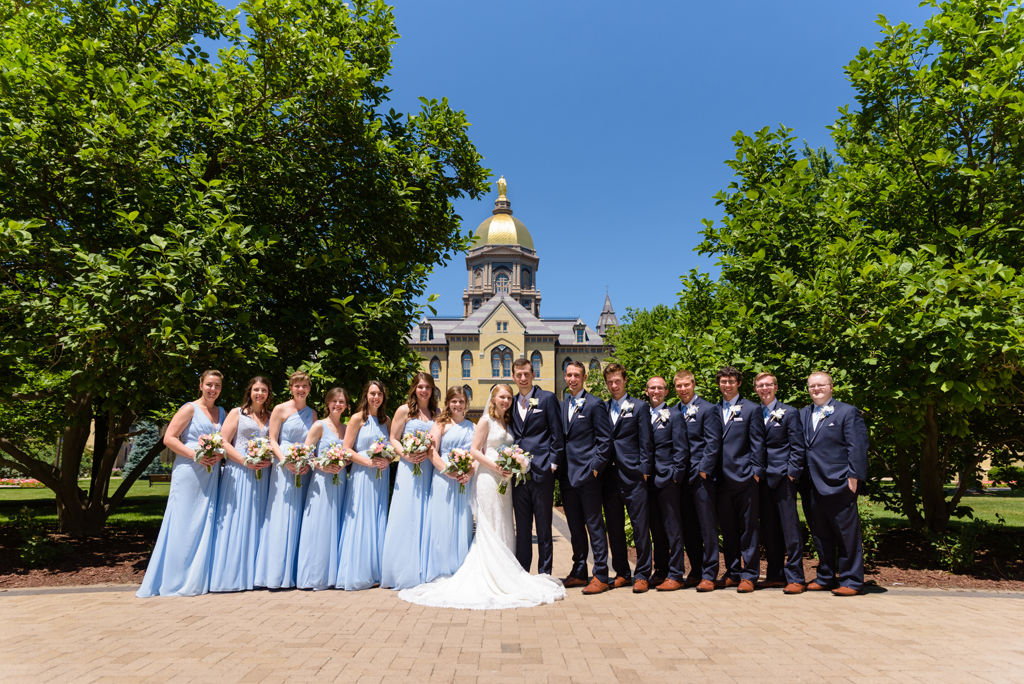 Bridal Party at the Golden Dome after a wedding ceremony at the Basilica of the Sacred Heart on the campus of the University of Notre Dame