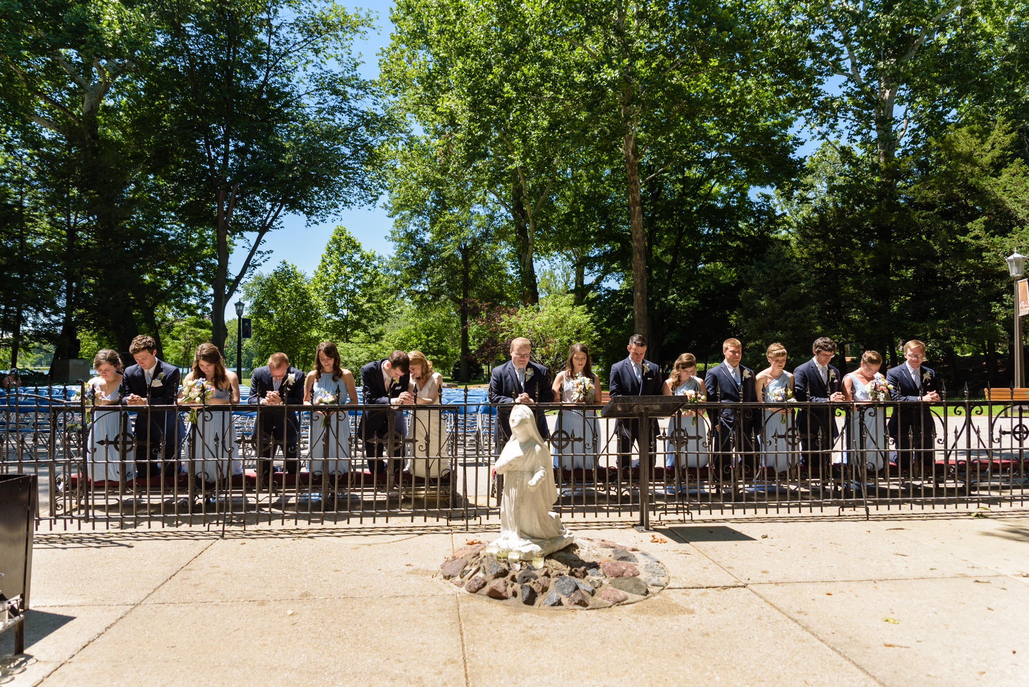 Bridal Party at the Grotto after a wedding ceremony at the Basilica of the Sacred Heart on the campus of the University of Notre Dame