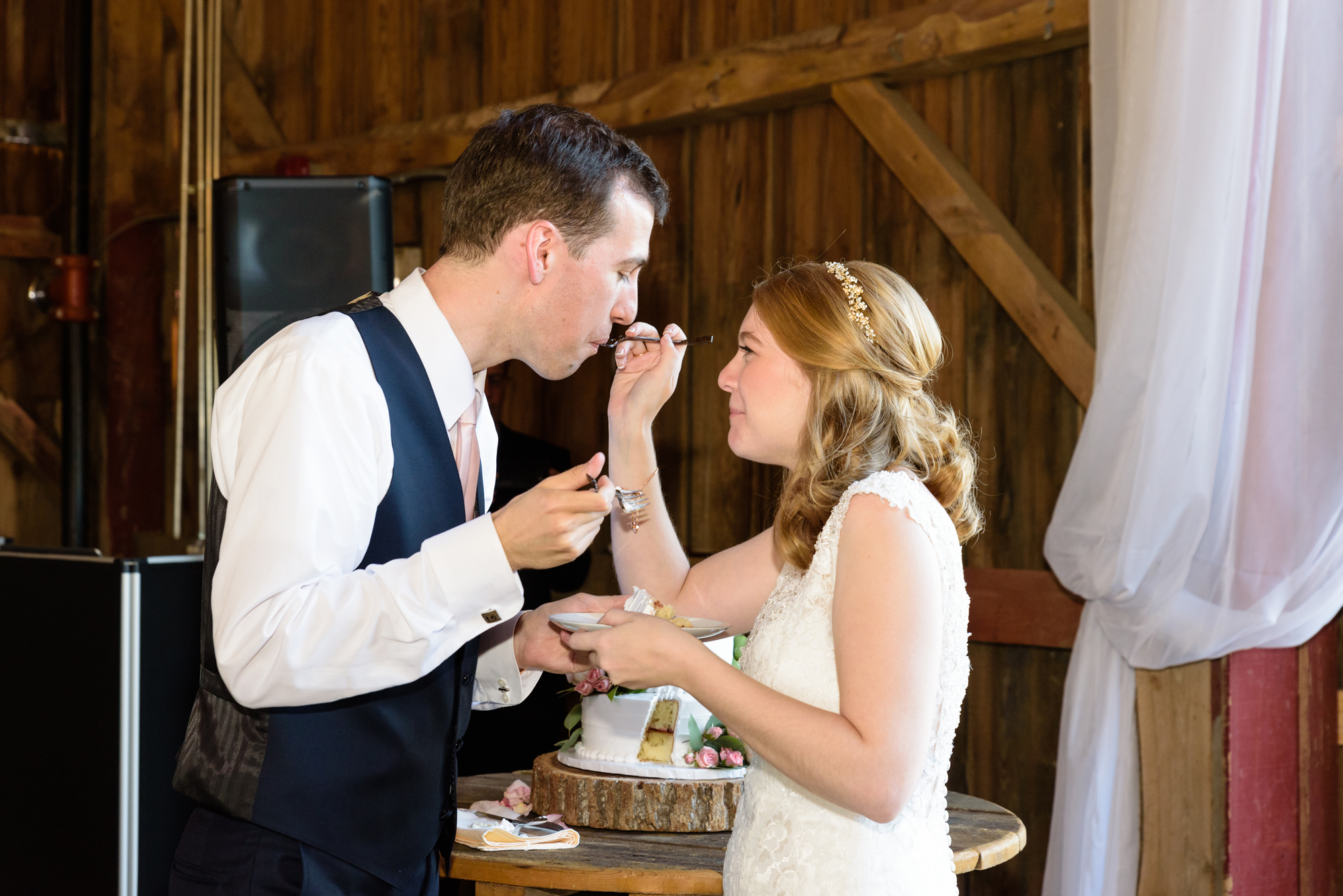 Bride & Groom’s cake cutting at a Wedding Reception at Blissful Barn