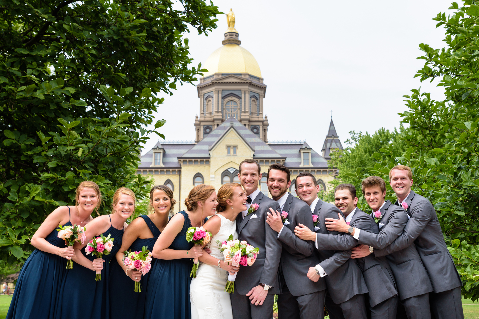 Bridal Party at the Golden Dome after a wedding ceremony at the Basilica of the Sacred Heart on the campus of the University of Notre Dame