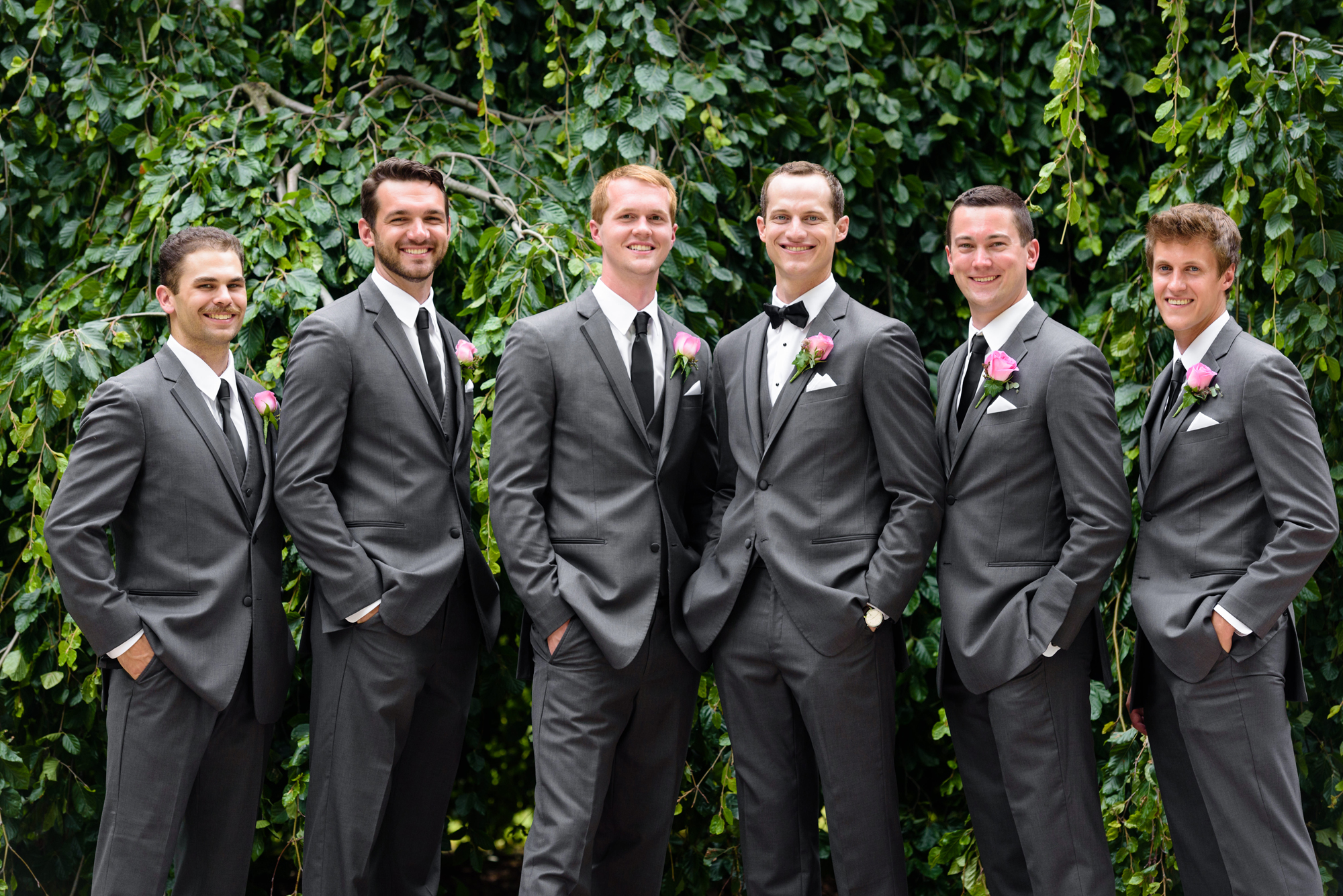 Groomsmen in front of an exotic California inspired tree after a wedding ceremony at the Basilica of the Sacred Heart on the campus of the University of Notre Dame