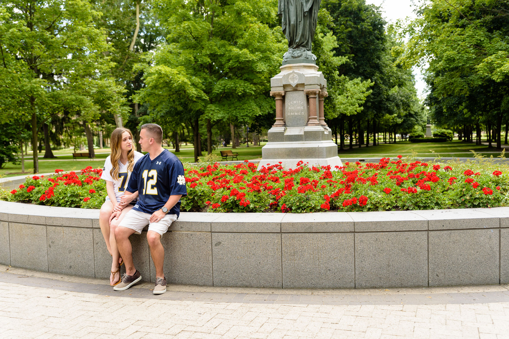 Engaged couple around God Quad on the campus of the University of Notre Dame