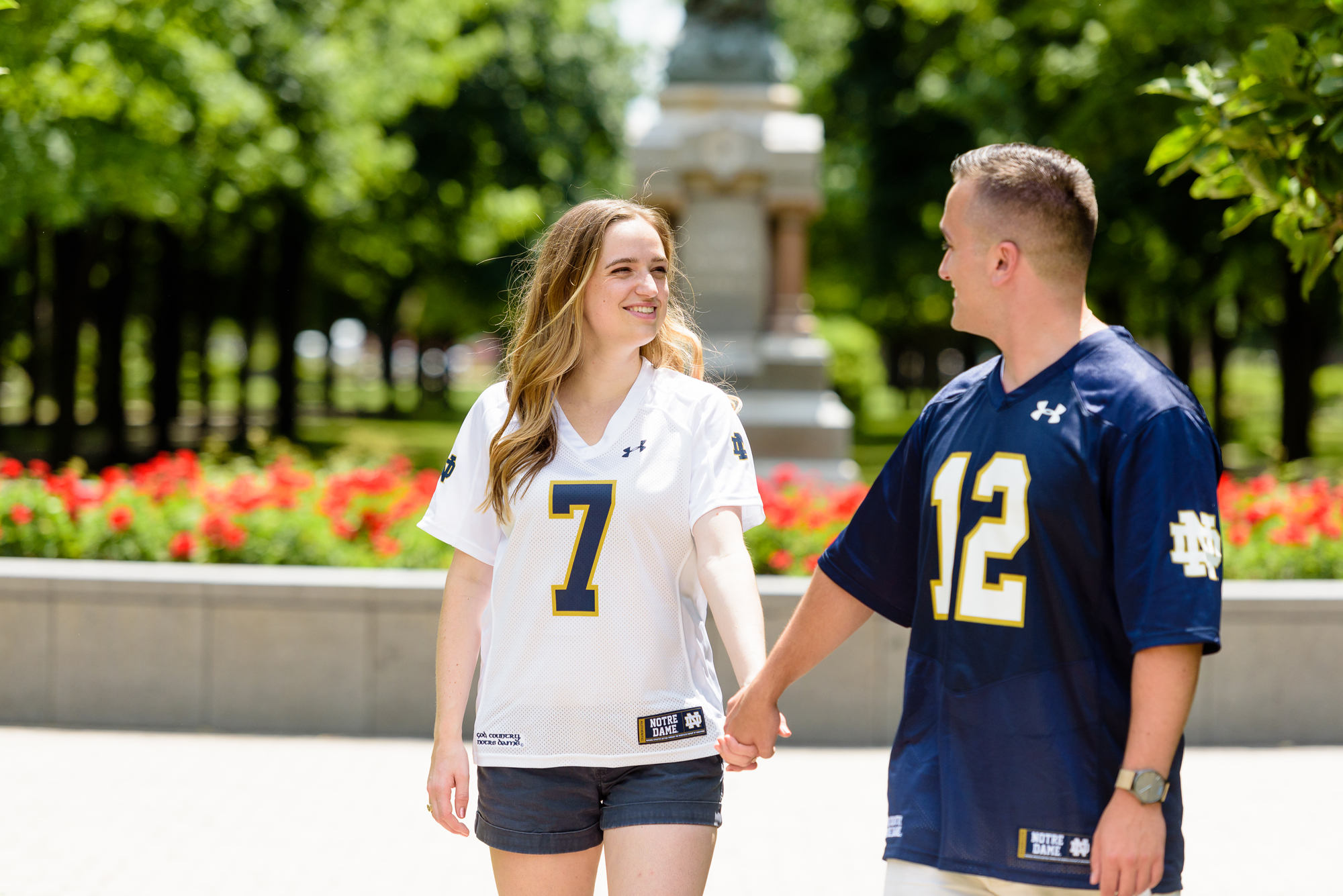 Engaged couple around God Quad on the campus of the University of Notre Dame