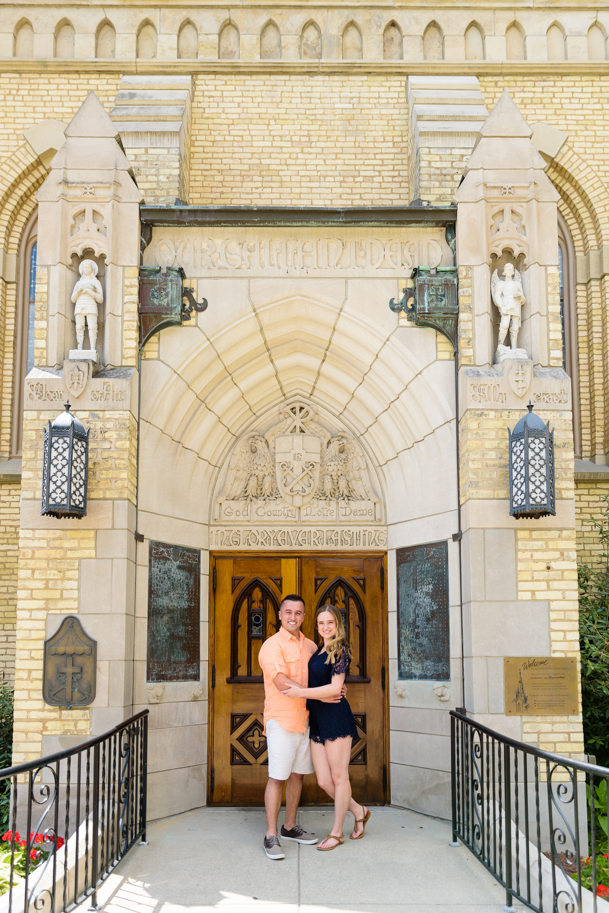 Engaged couple in front of God Country Door on the campus of the University of Notre Dame