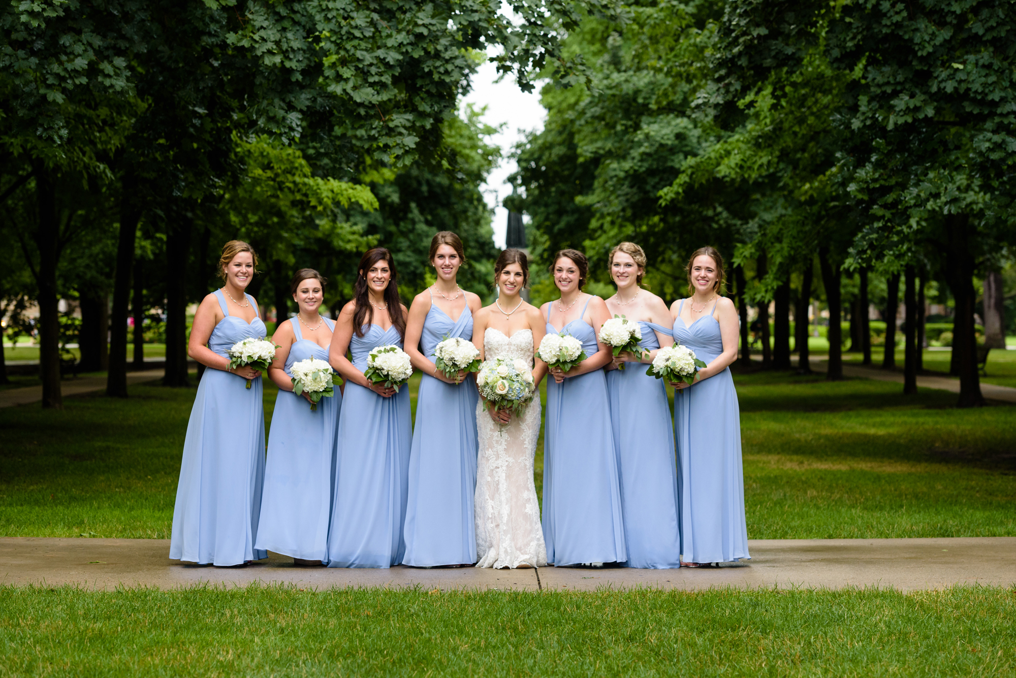 Bridesmaid on God Quad after a wedding ceremony at the Basilica of the Sacred Heart on the campus of the University of Notre Dame