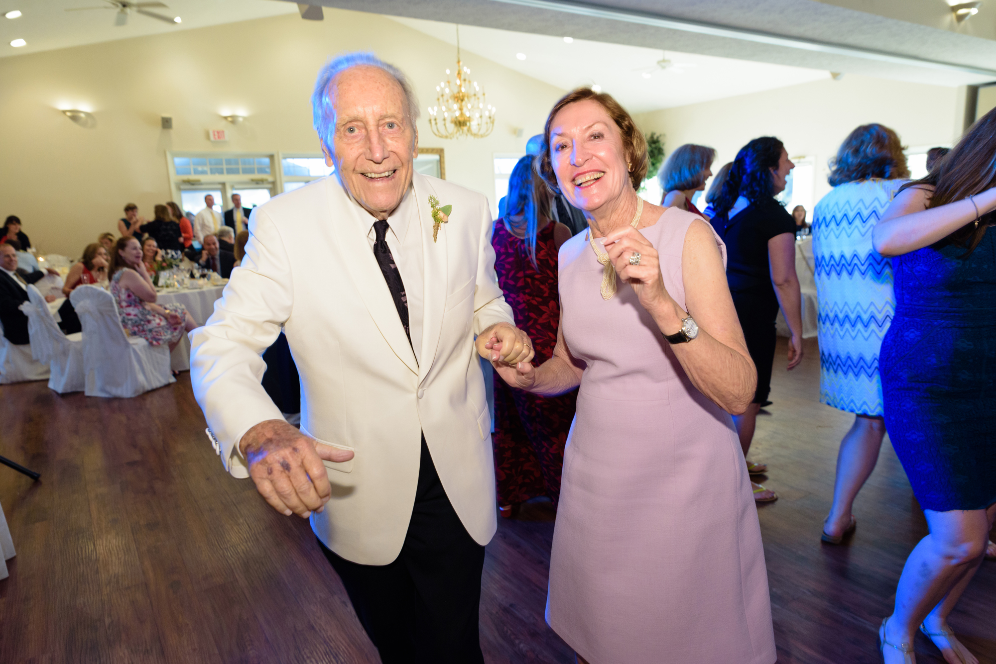 grandparents dancing on the dance floor at a wedding reception