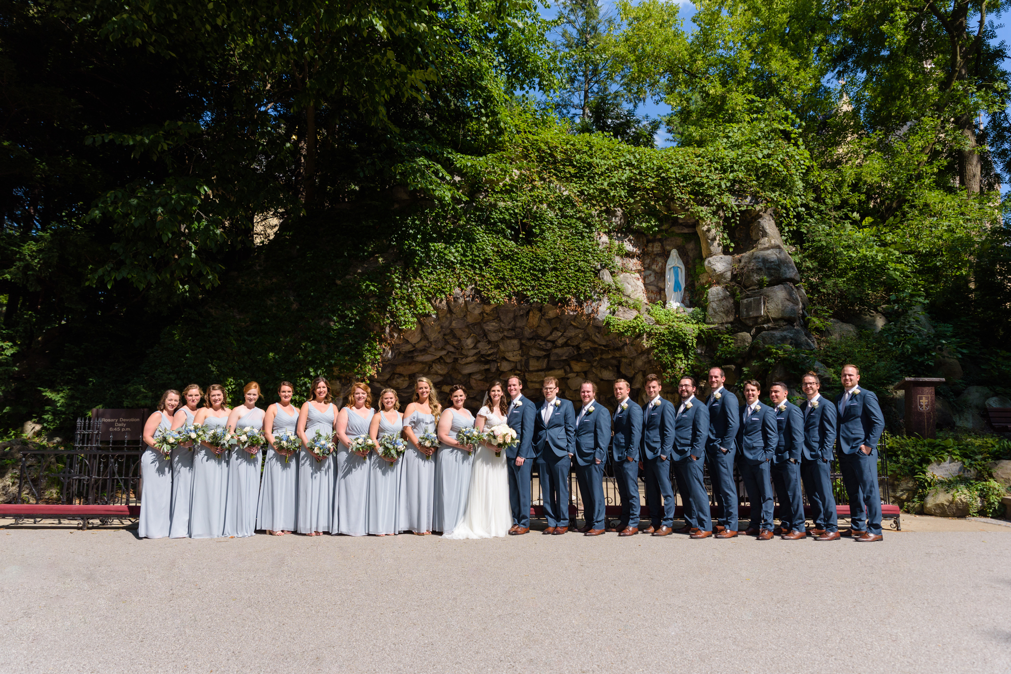 Bridal Party at the Grotto after a wedding ceremony at the Basilica of the Sacred Heart on the campus of the University of Notre Dame