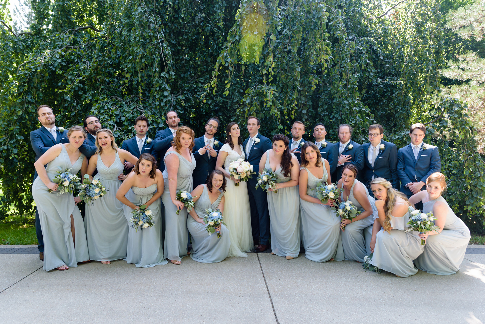 Bridal Party in front of an exotic California inspired tree after a wedding ceremony at the Basilica of the Sacred Heart on the campus of the University of Notre Dame
