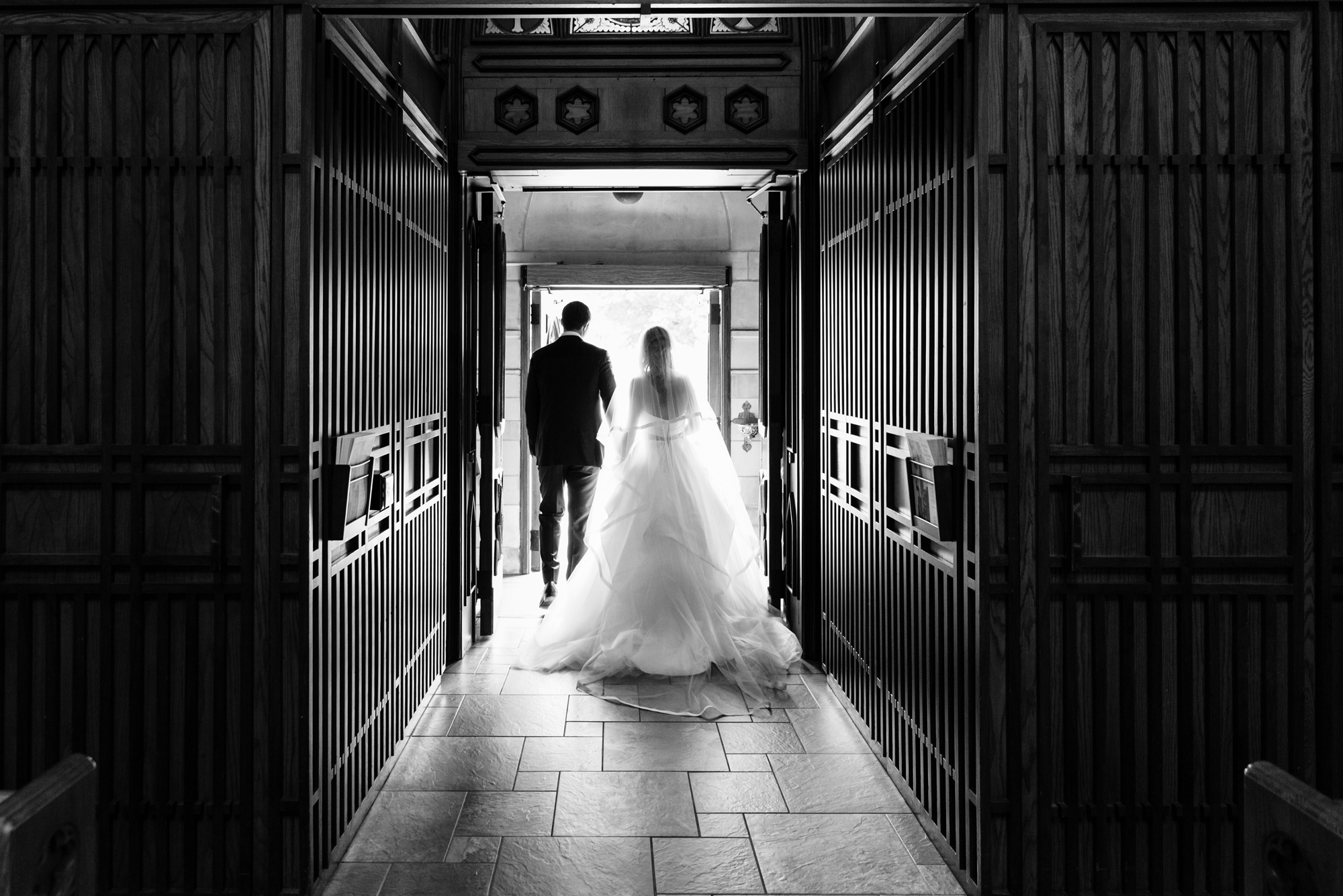 Bride & Groom leaving their wedding ceremony out the God Country Door at the Basilica of the Sacred Heart on the campus of the University of Notre Dame