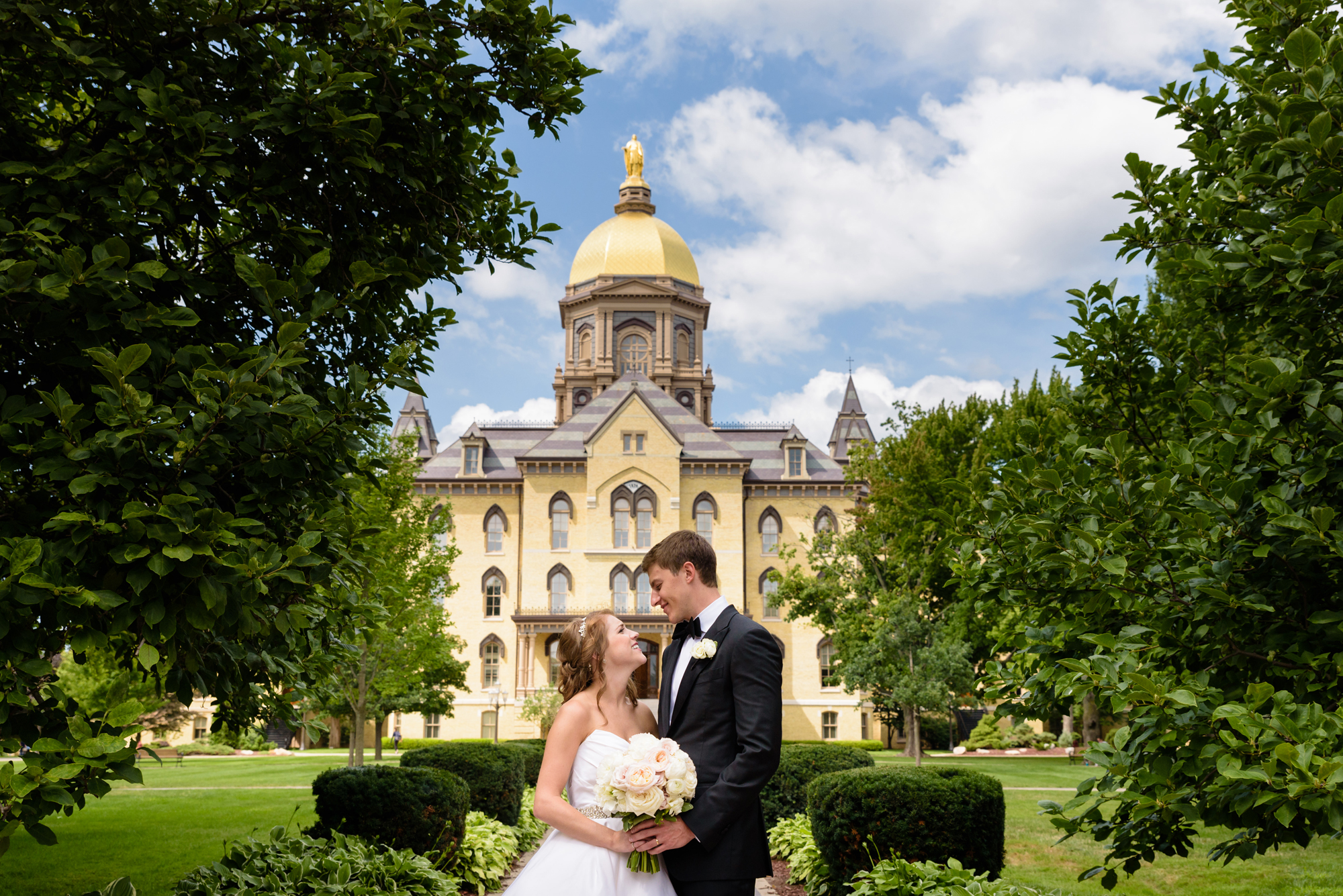 Bride & Groom in front the Golden Dome after their wedding ceremony at the Basilica of the Sacred Heart on the campus of the University of Notre Dame