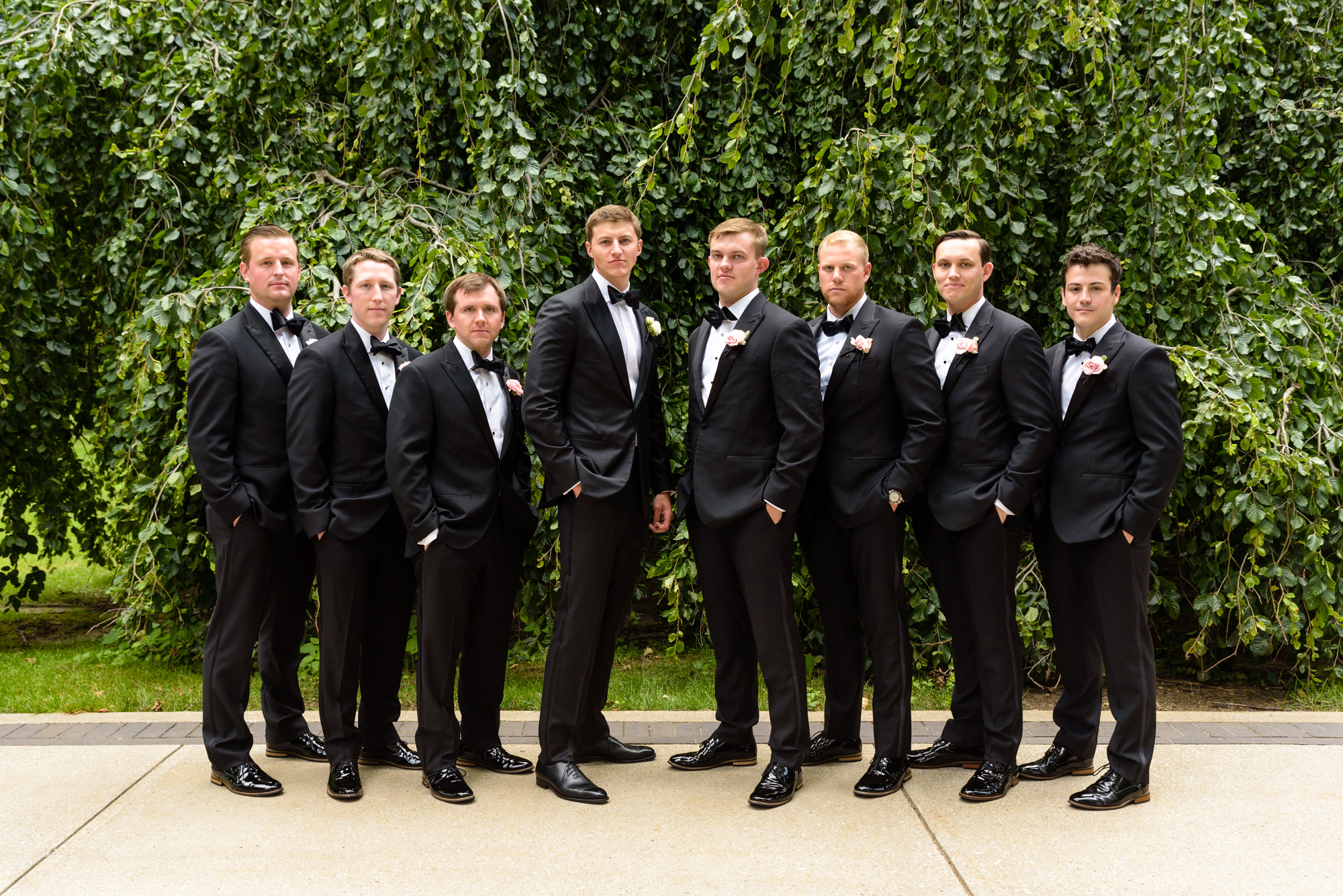 Groomsmen in front of an exotic California inspired tree after a wedding ceremony at the Basilica of the Sacred Heart on the campus of the University of Notre Dame