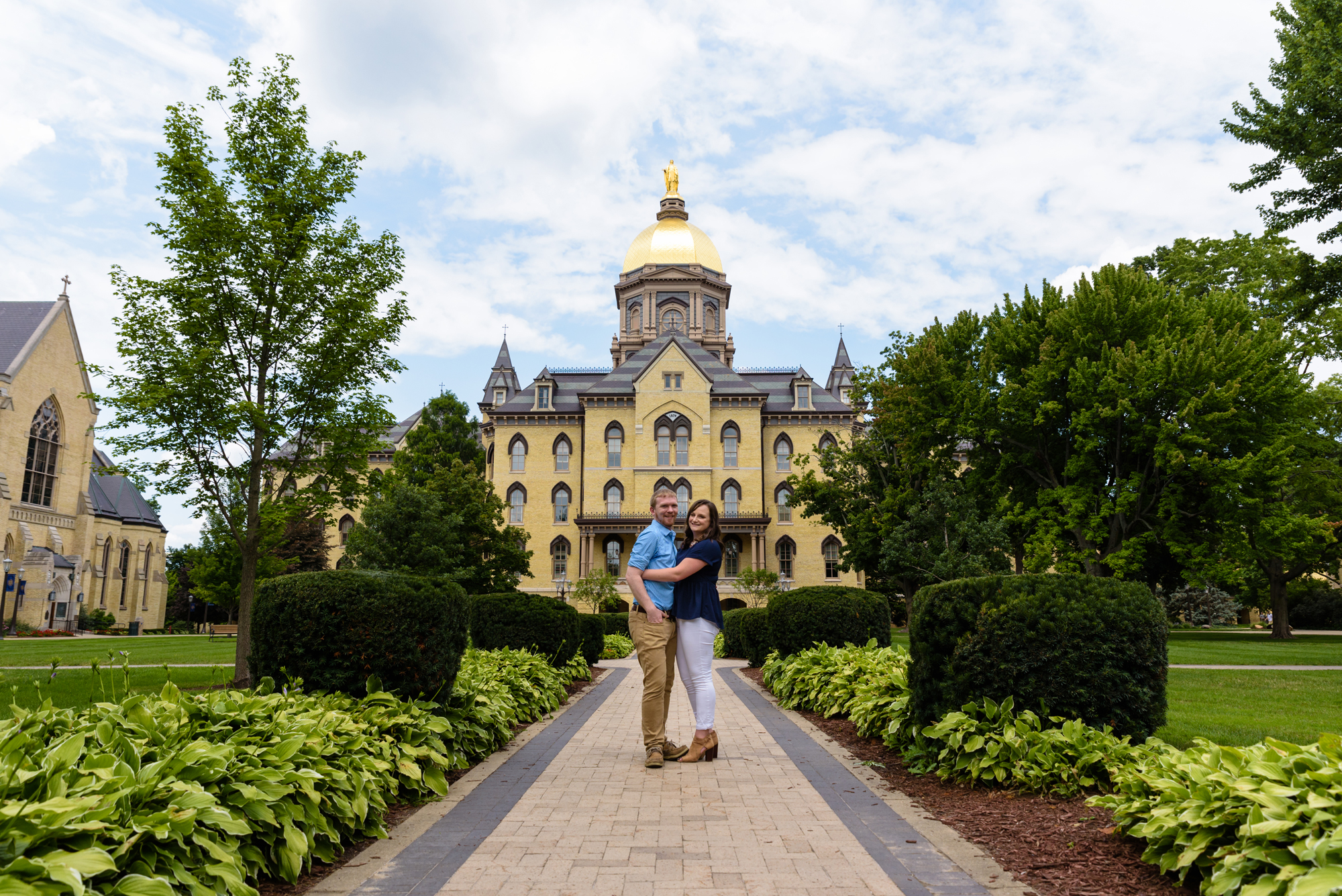Engaged couple in front of the Dome on the campus of the University of Notre Dame