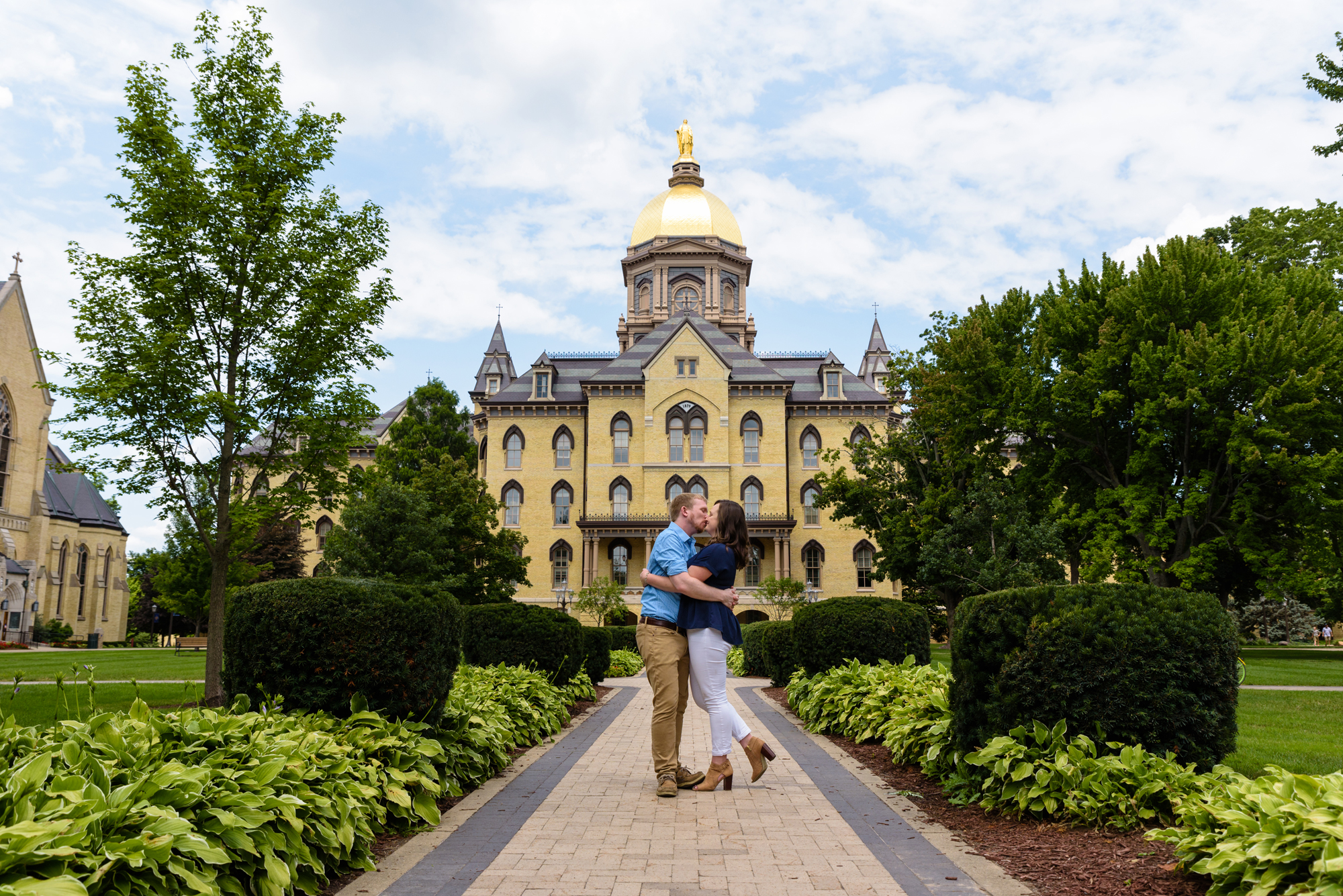 Engaged couple in front of the Dome on the campus of the University of Notre Dame