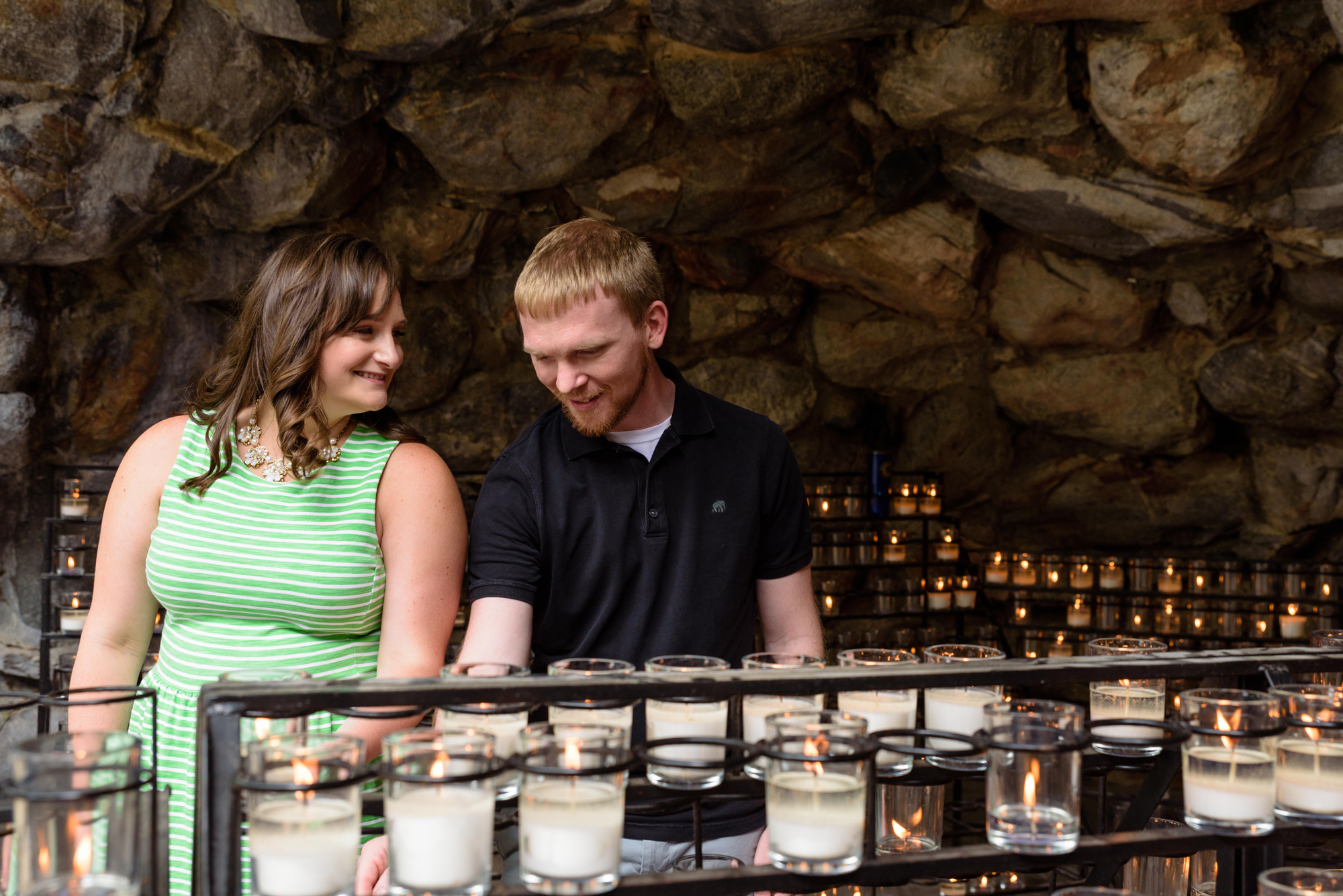 Engaged couple at the Grotto on the campus of the University of Notre Dame