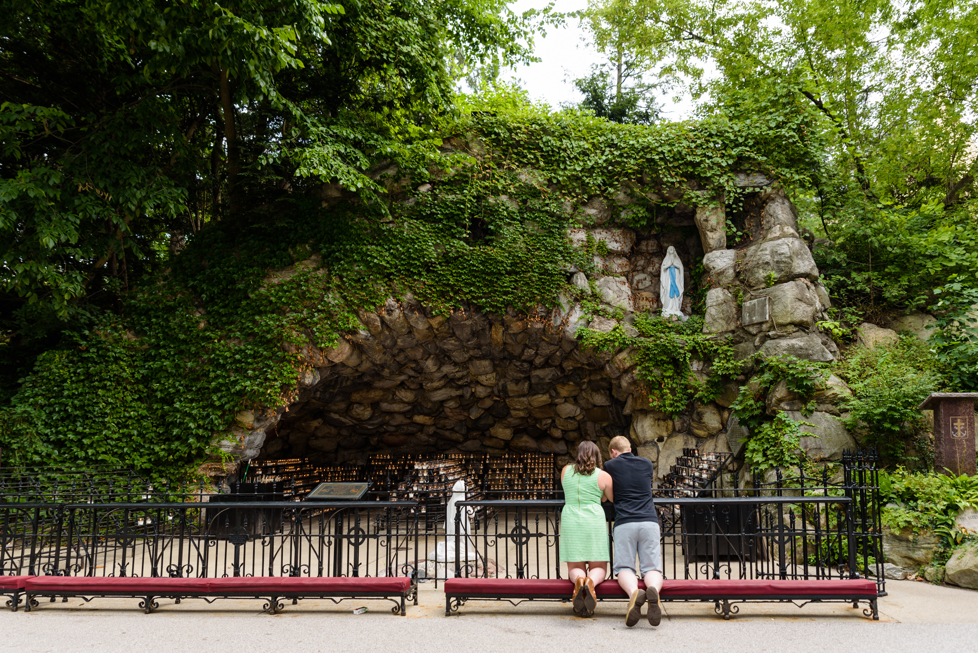 Engaged couple at the Grotto on the campus of the University of Notre Dame