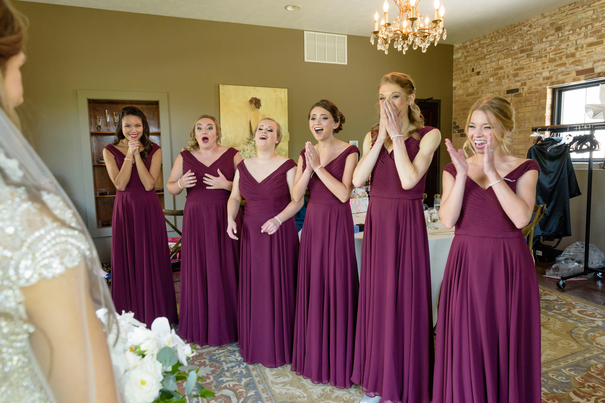 Bridesmaid reveal before a wedding ceremony at the Armory