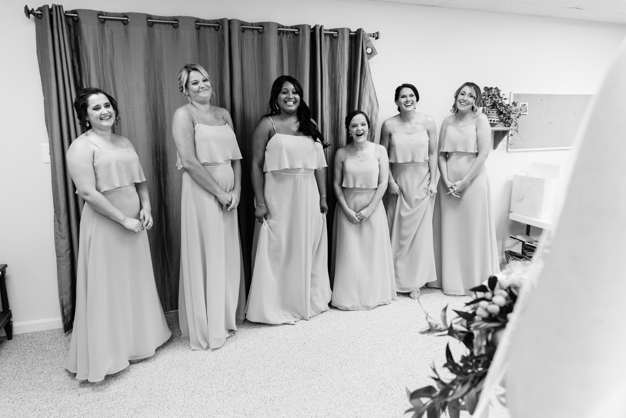 Bridesmaid reveal before a wedding ceremony at Christ the King Lutheran Church