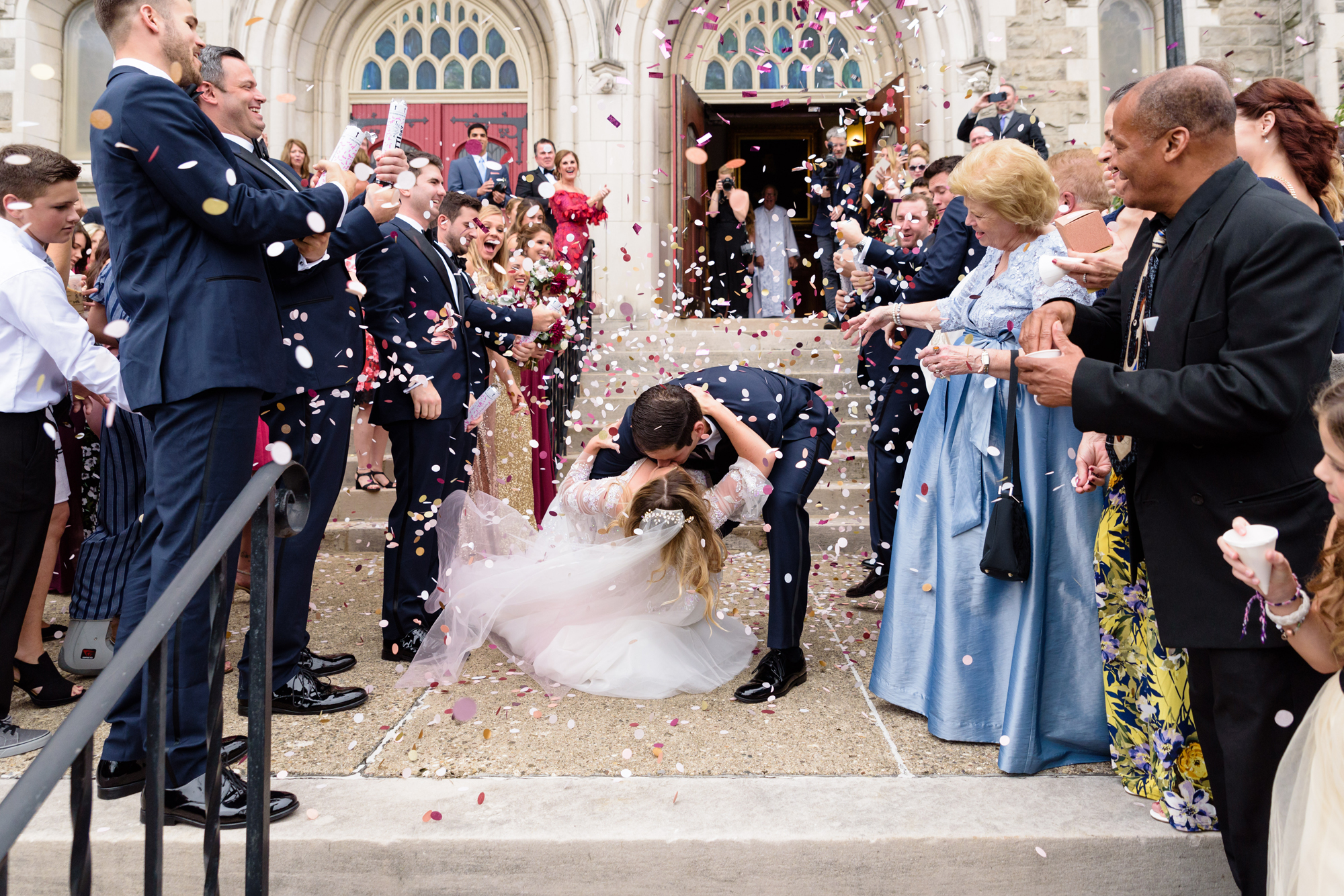 Bride & Groom leaving their wedding ceremony with a confetti exit at St. Paul’s Memorial United Methodist Church